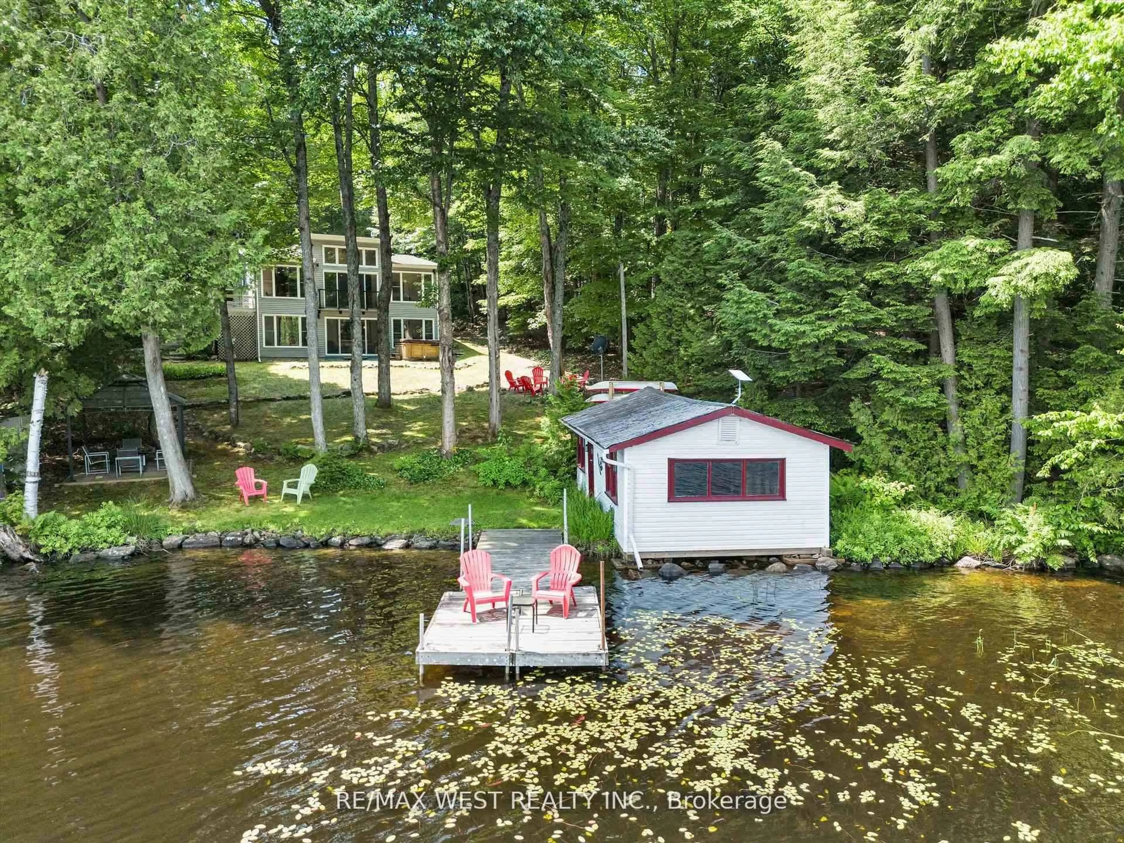 A pic from outside/outdoor area/front of a property/back of a property/a pic from drone, water/lake/river/ocean view for 1091 Mcarthur Point Rd, Lake of Bays Ontario P0B 1A0
