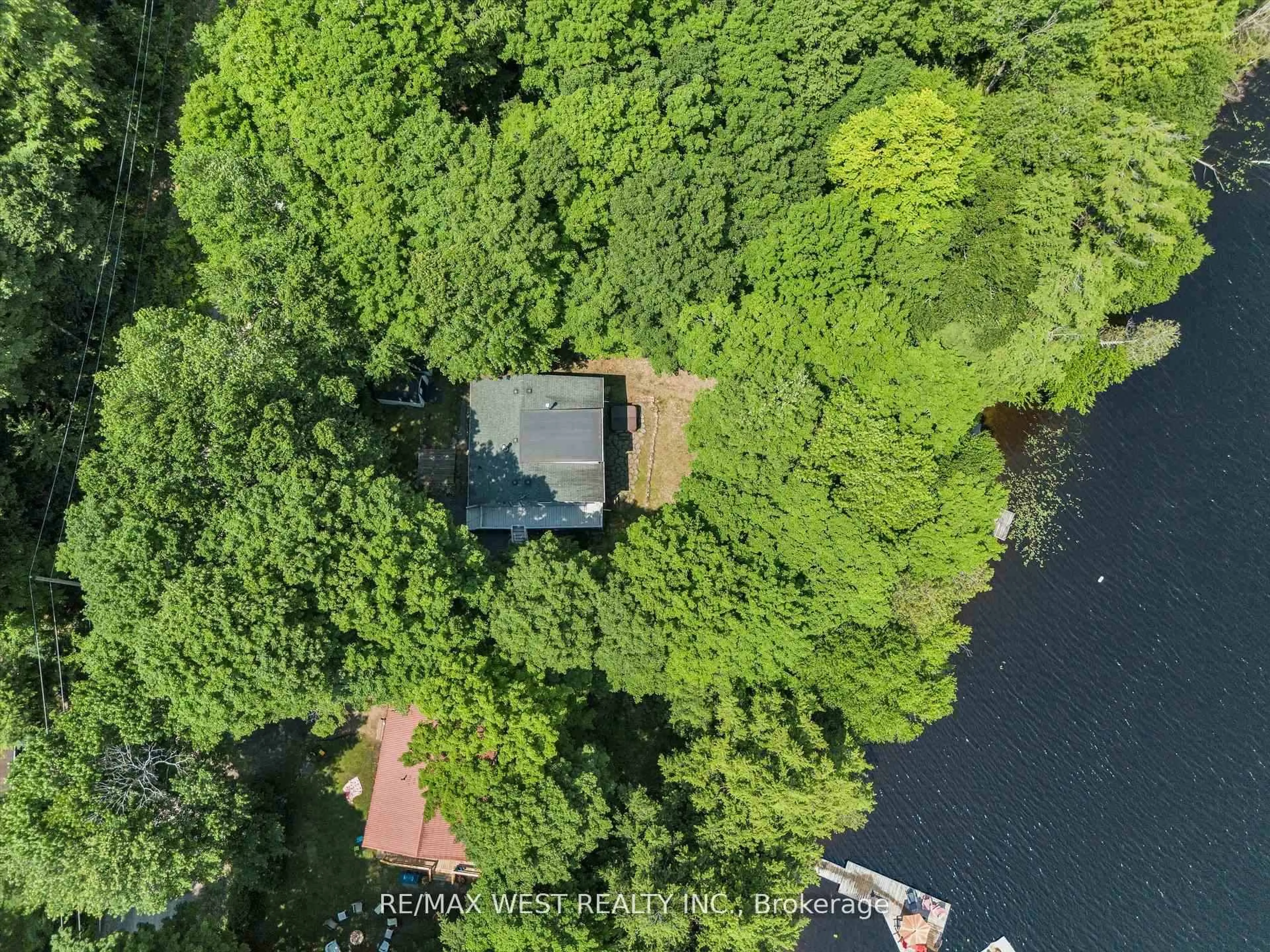 A pic from outside/outdoor area/front of a property/back of a property/a pic from drone, water/lake/river/ocean view for 1091 Mcarthur Point Rd, Lake of Bays Ontario P0B 1A0