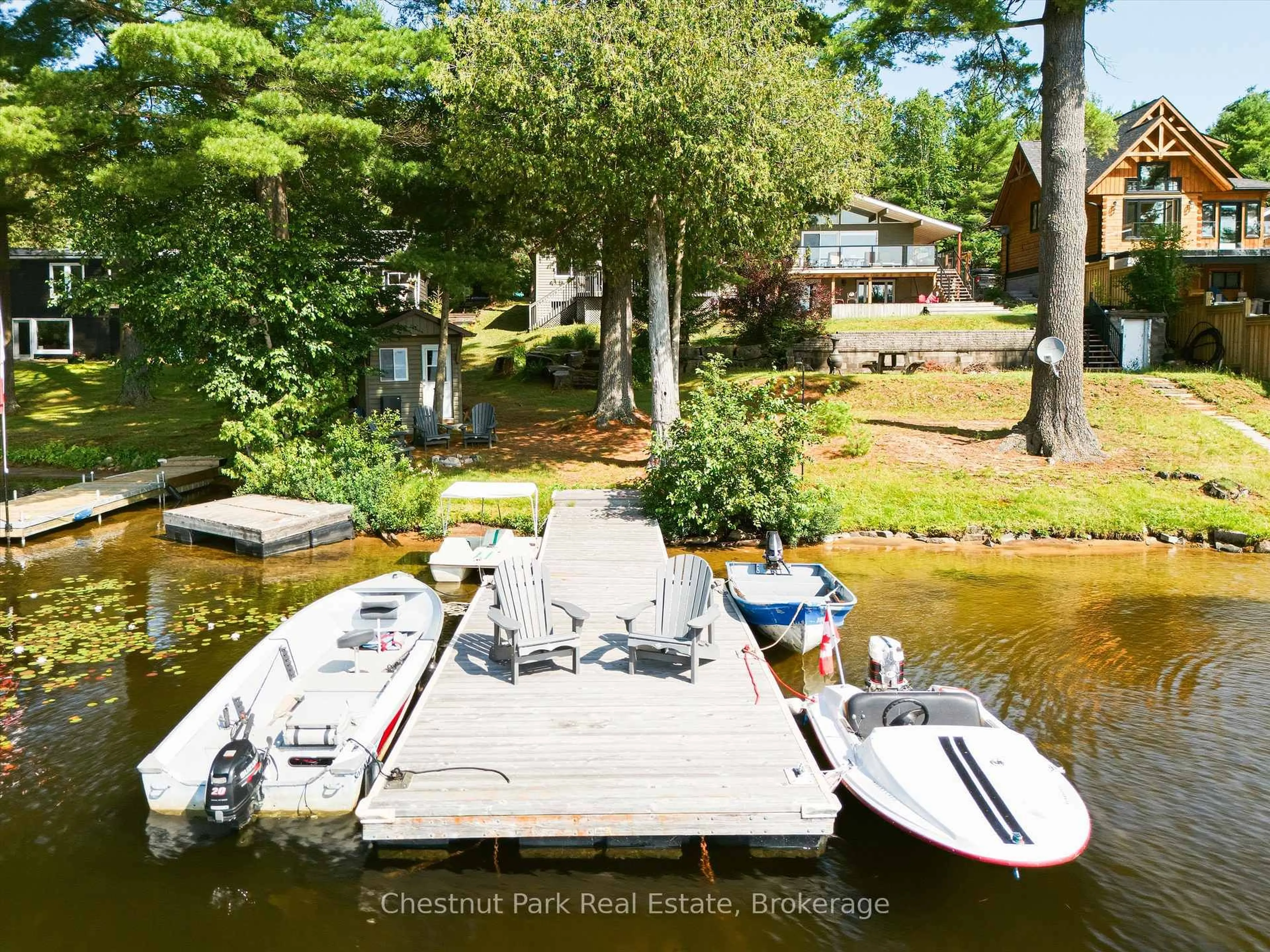 A pic from outside/outdoor area/front of a property/back of a property/a pic from drone, water/lake/river/ocean view for 1014 Kelly Rd, Lake of Bays Ontario P0B 1A0