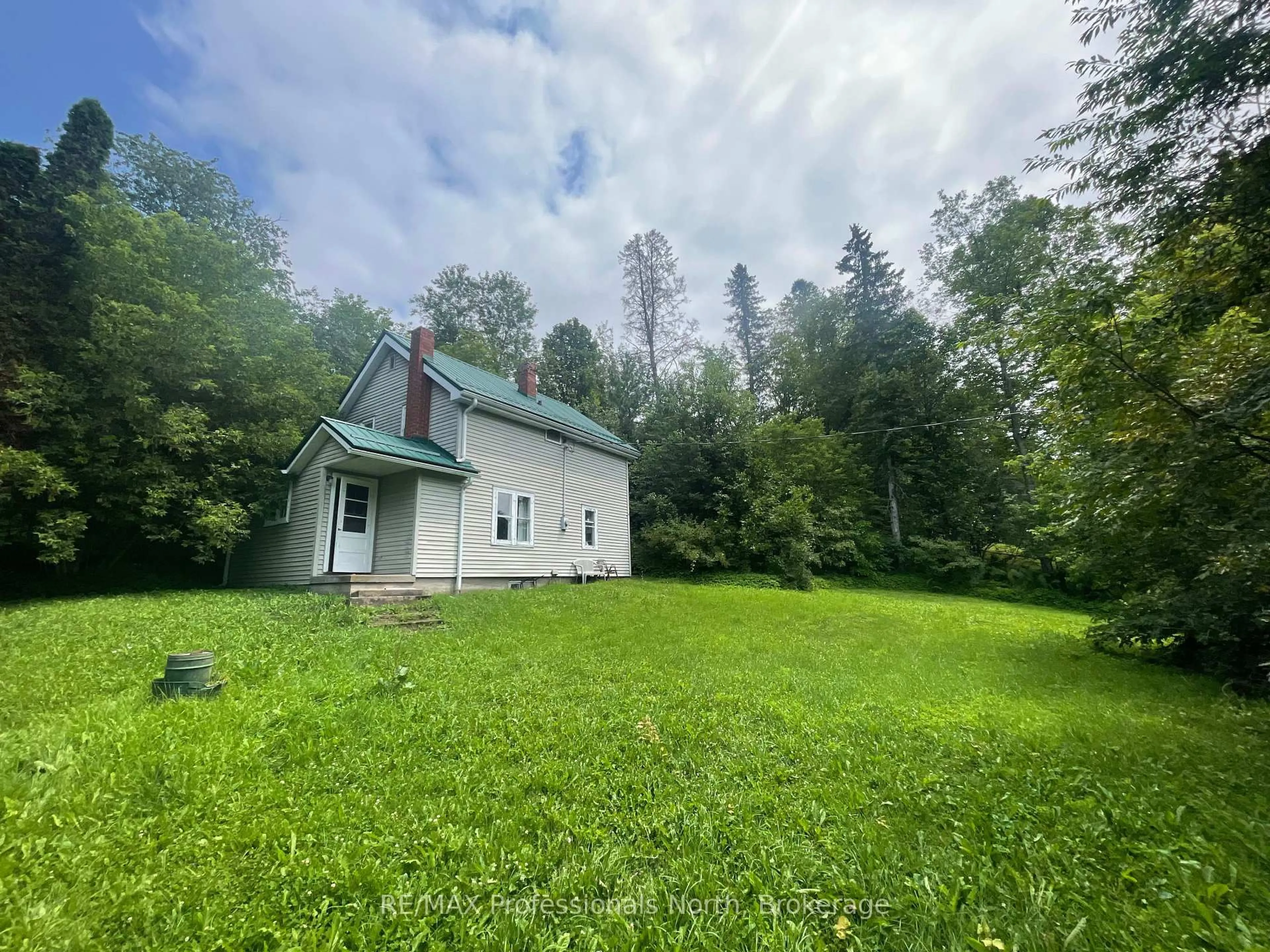 A pic from outside/outdoor area/front of a property/back of a property/a pic from drone, forest/trees view for 1038 Gooderham St, Highlands East Ontario K0M 1R0