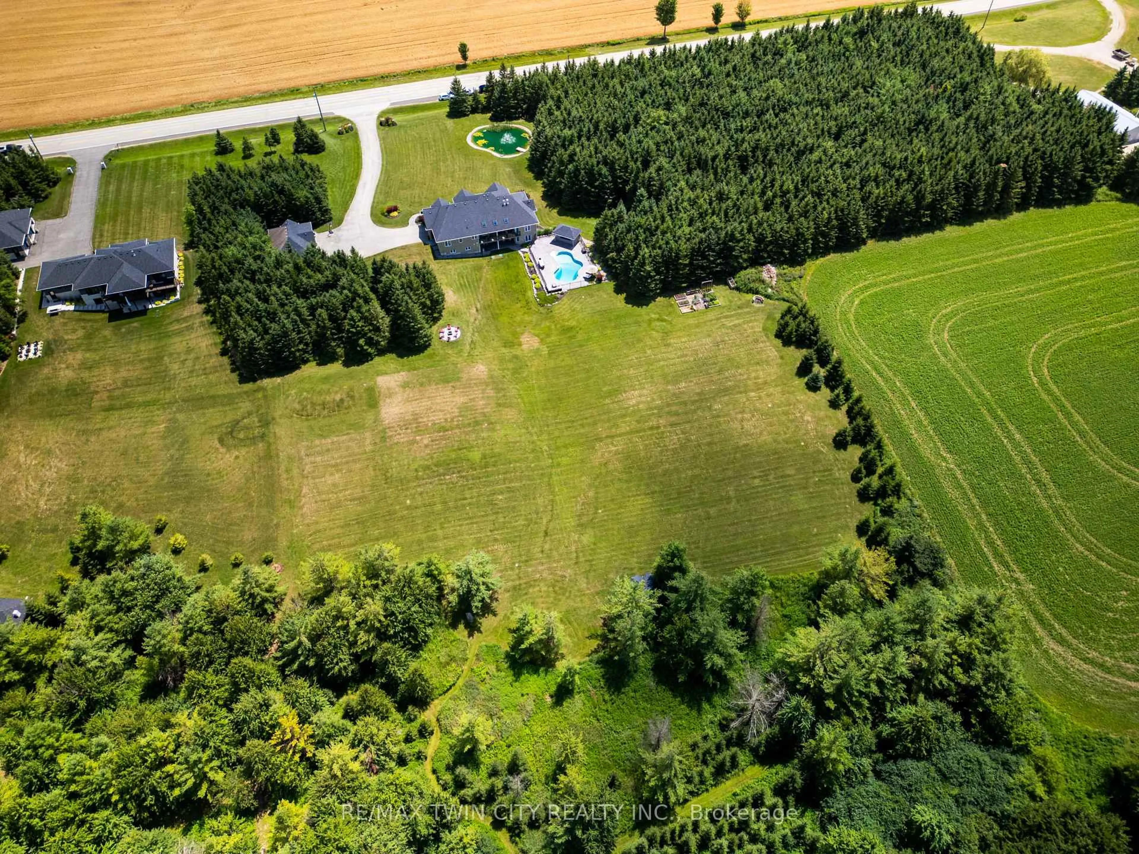 A pic from outside/outdoor area/front of a property/back of a property/a pic from drone, forest/trees view for 7118 Wellington Rd 11 Rd, Mapleton Ontario N0G 1P0