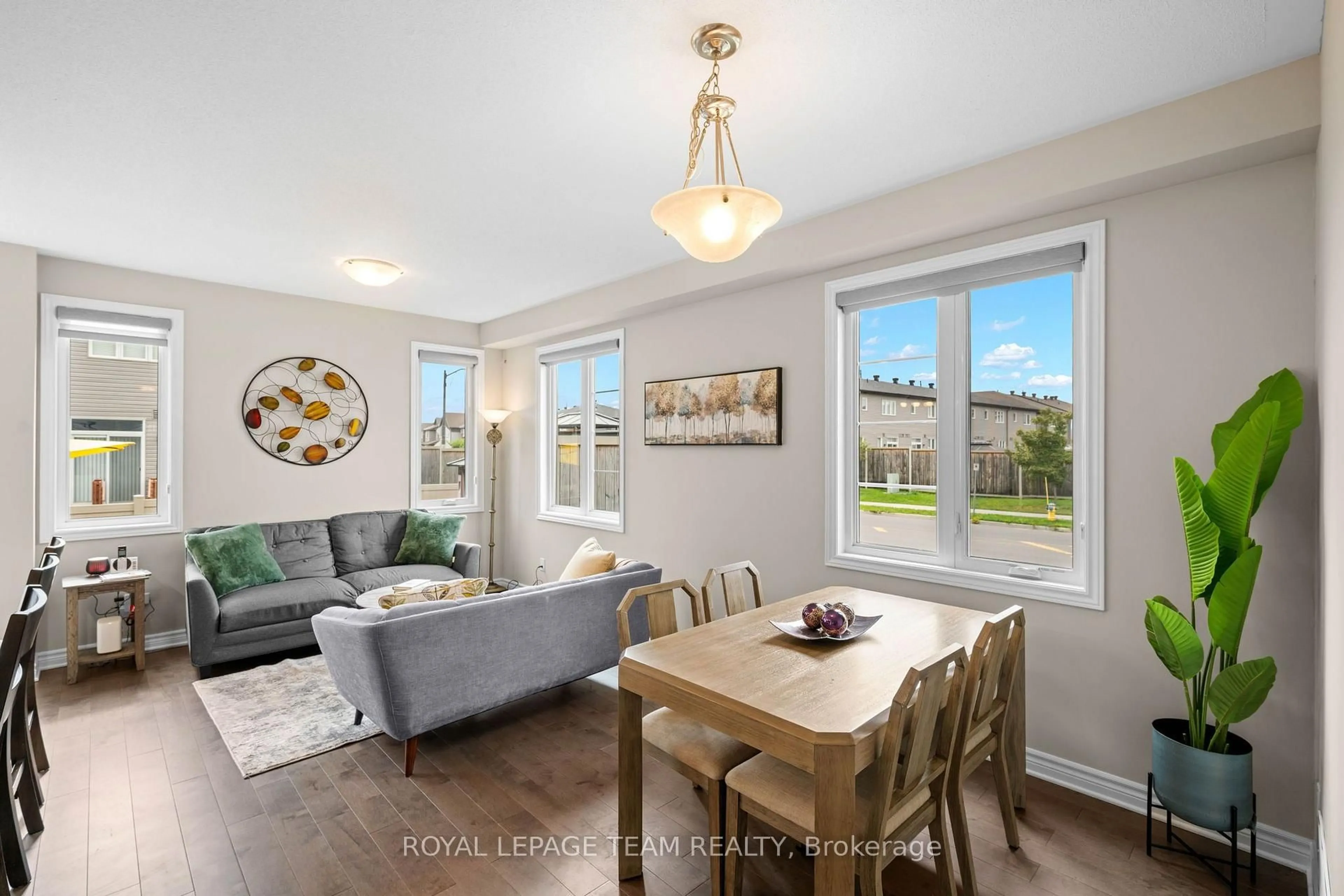 Living room with furniture, wood/laminate floor for 661 Jerome Jodoin Dr, Ottawa Ontario K4A 1G9