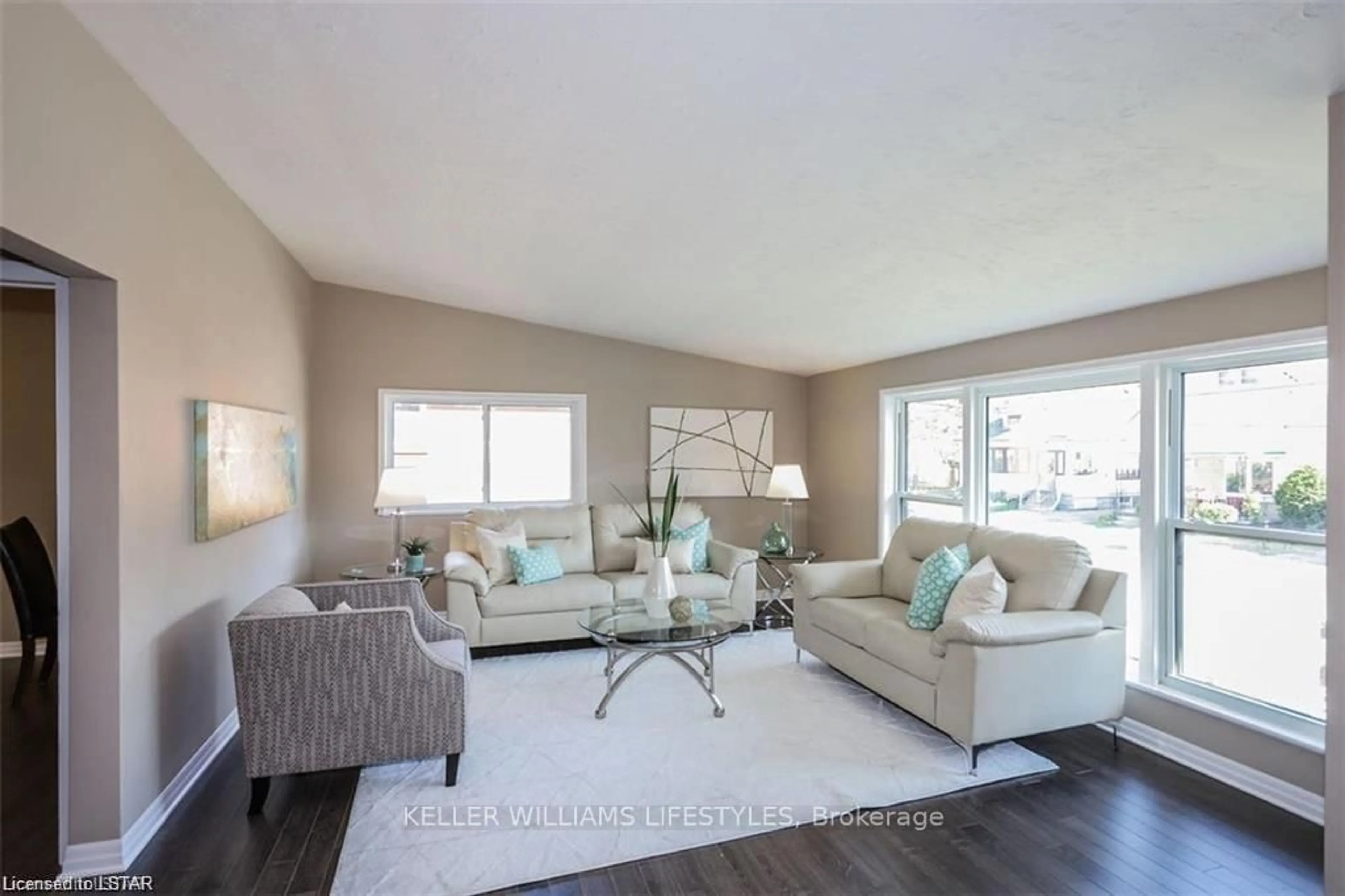 Living room with furniture, wood/laminate floor for 61-63 DILLABOUGH St, London East Ontario N5Z 2B9
