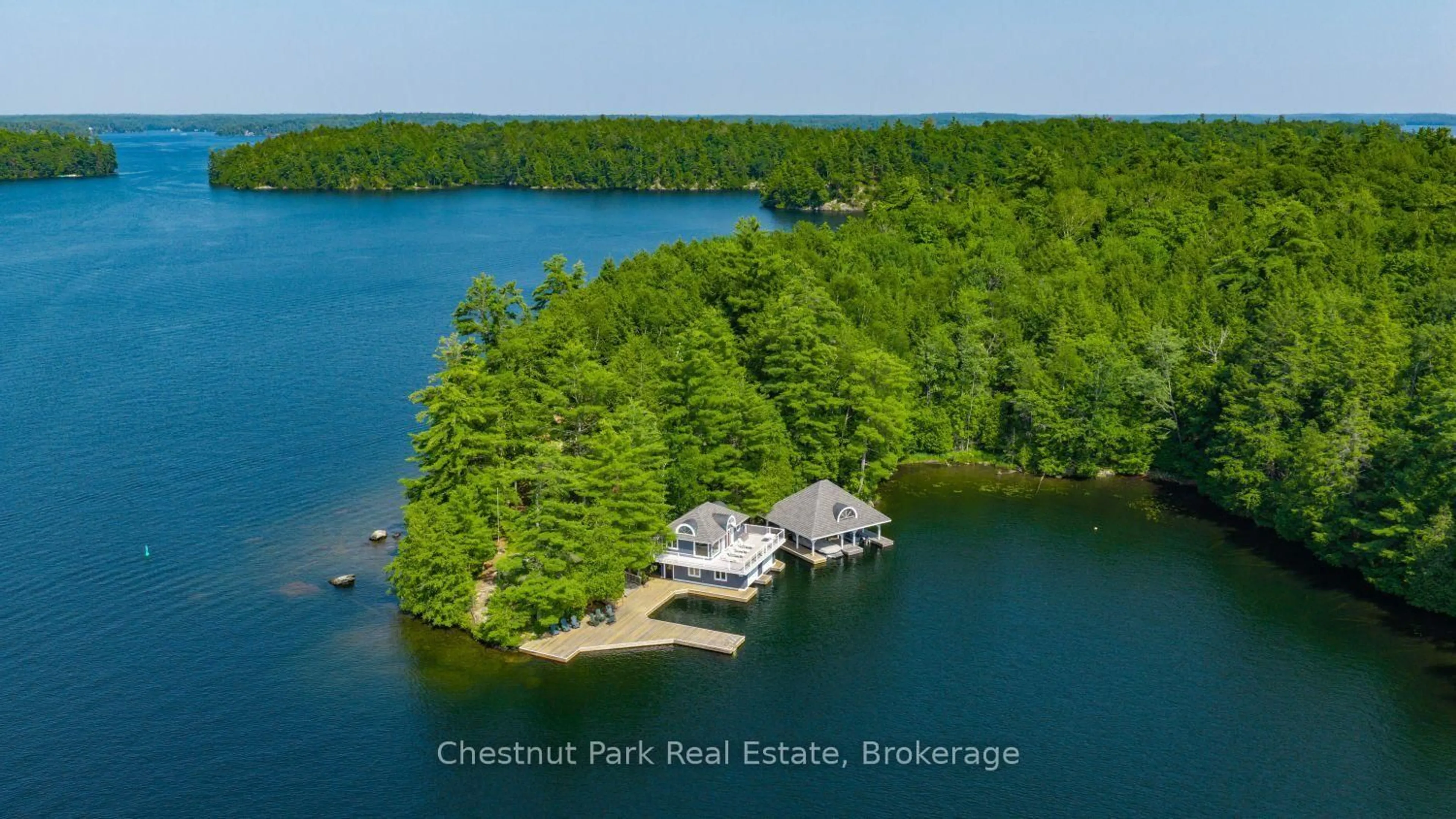 A pic from outside/outdoor area/front of a property/back of a property/a pic from drone, water/lake/river/ocean view for 1 Playfair Island #3, Seguin Ontario P0C 1H0