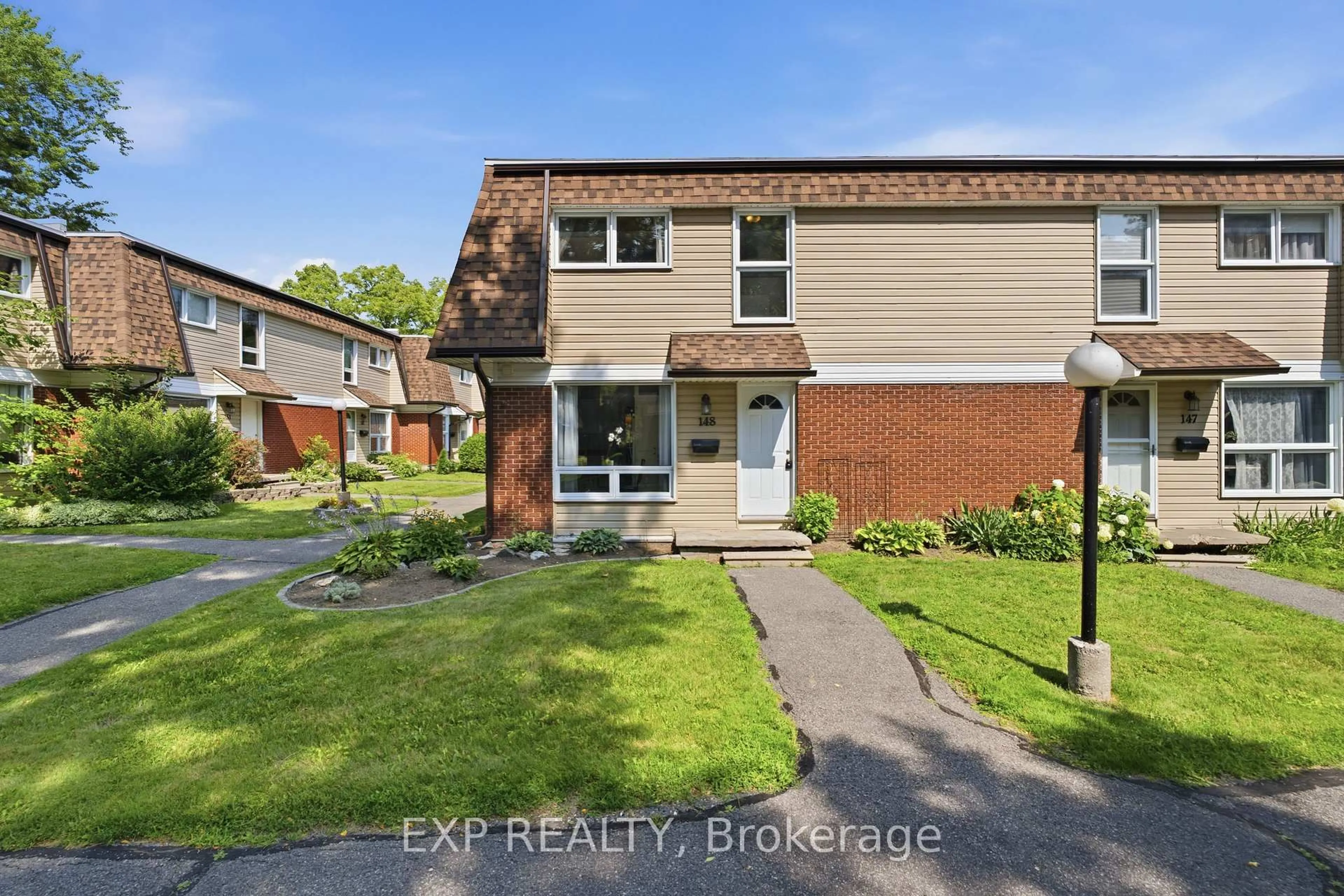 A pic from outside/outdoor area/front of a property/back of a property/a pic from drone, street for 148 Rutherford Crt #16, Ottawa Ontario K2K 1N6