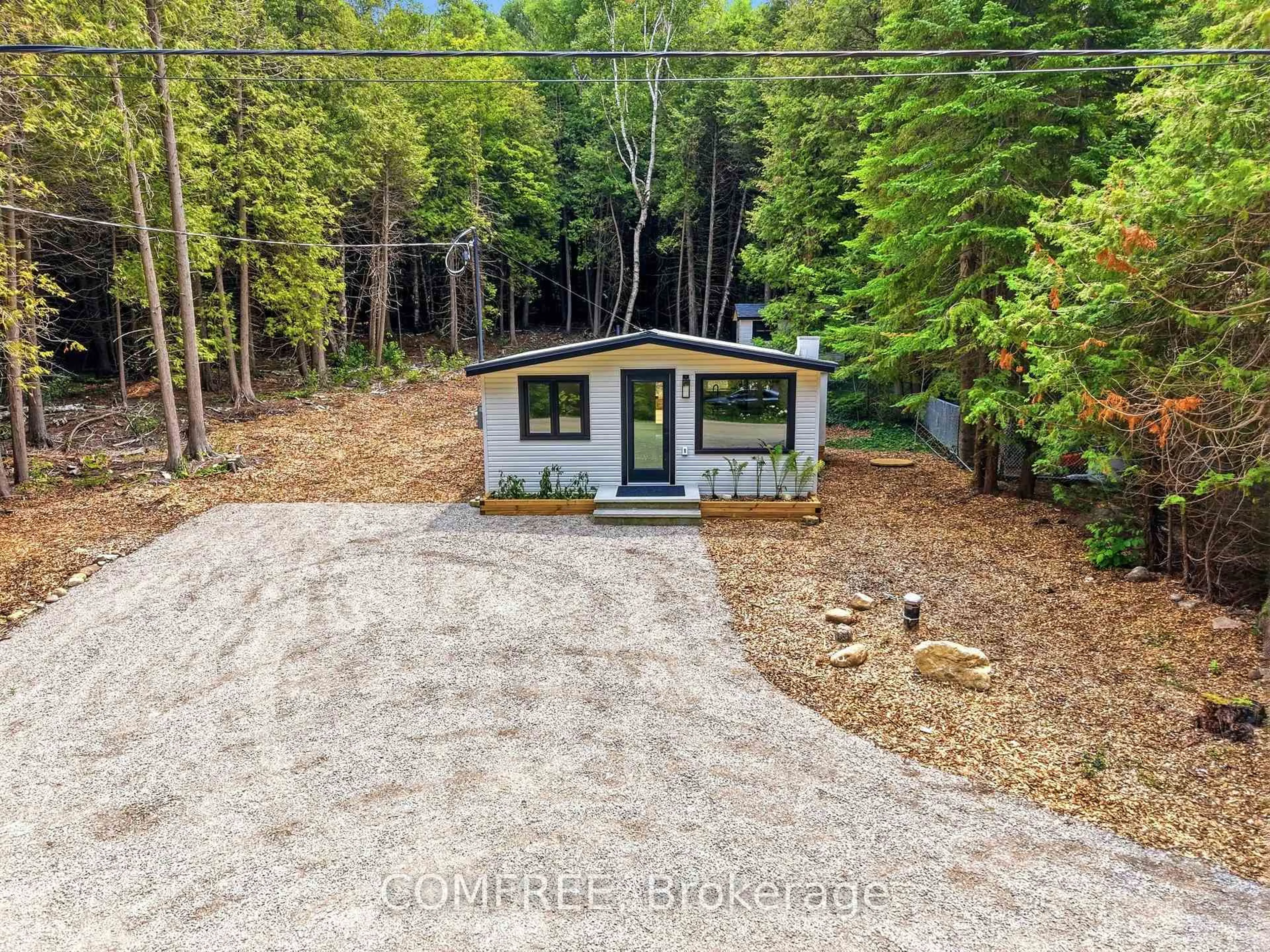 A pic from outside/outdoor area/front of a property/back of a property/a pic from drone, forest/trees view for 86 South Shore Rd, Northern Bruce Peninsula Ontario N0H 1W0