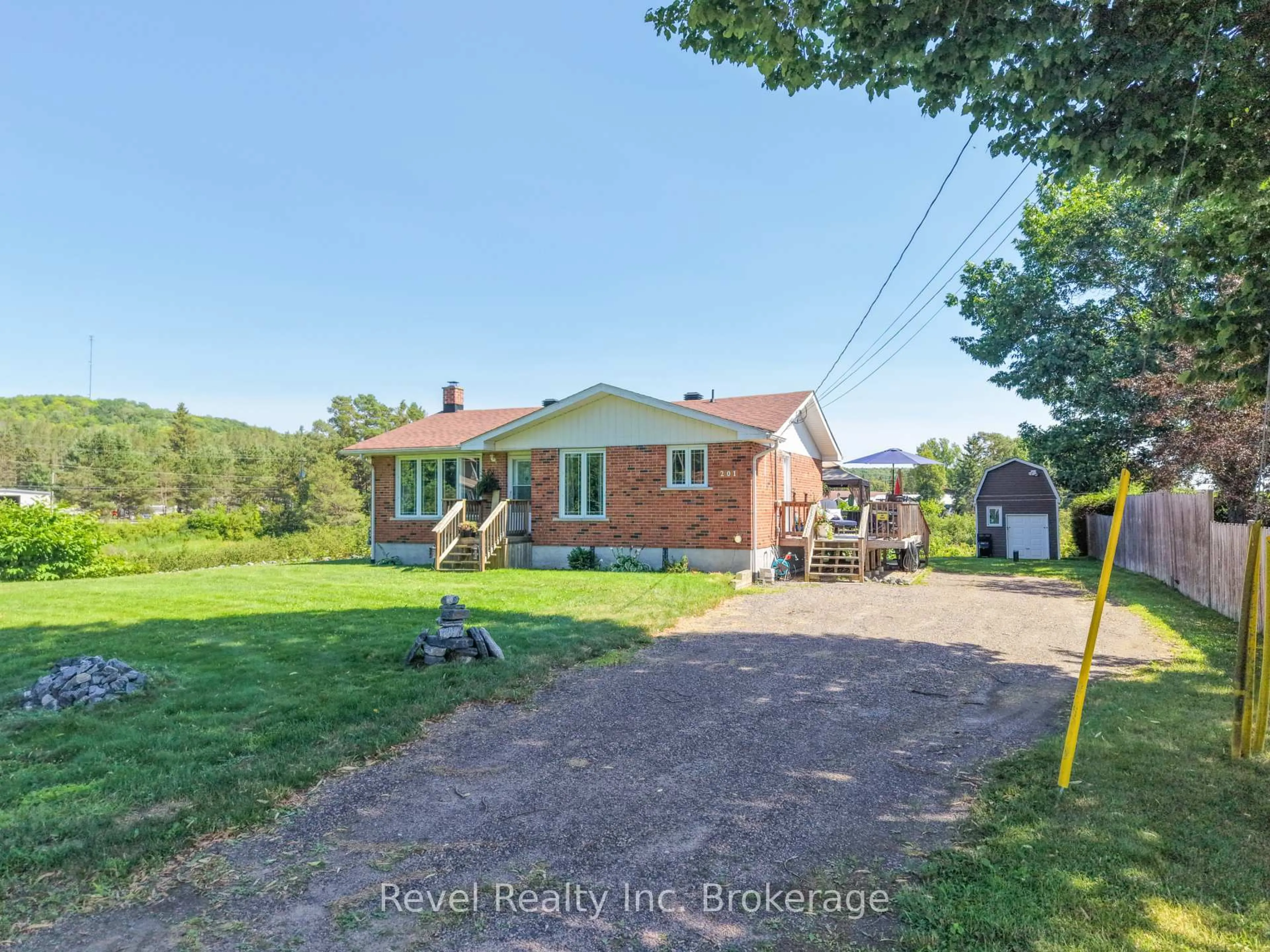 A pic from outside/outdoor area/front of a property/back of a property/a pic from drone, street for 201 Bird St, Powassan Ontario P0H 2L0