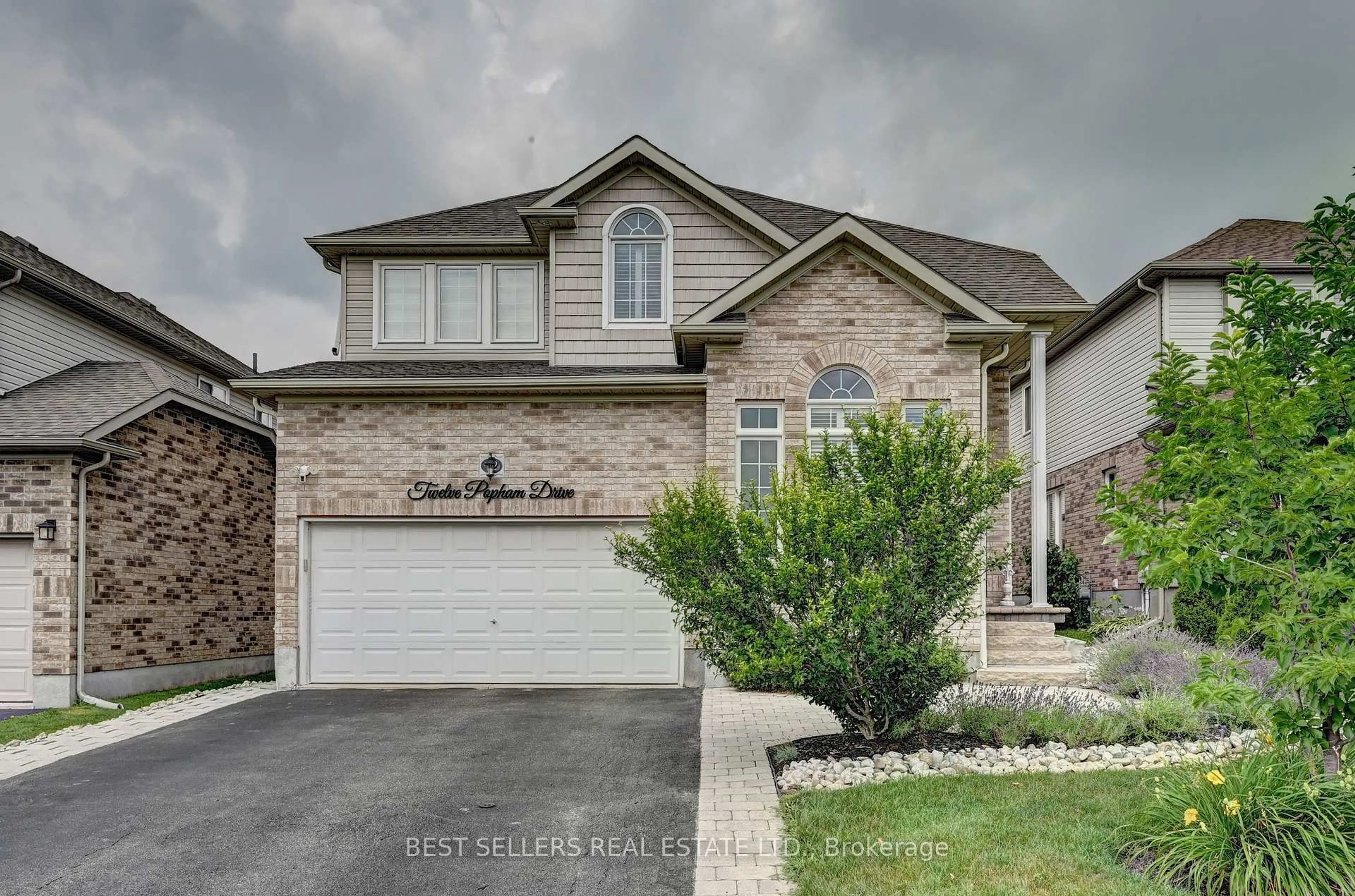 Home with brick exterior material, street for 12 Popham Dr, Guelph Ontario N1E 0B7