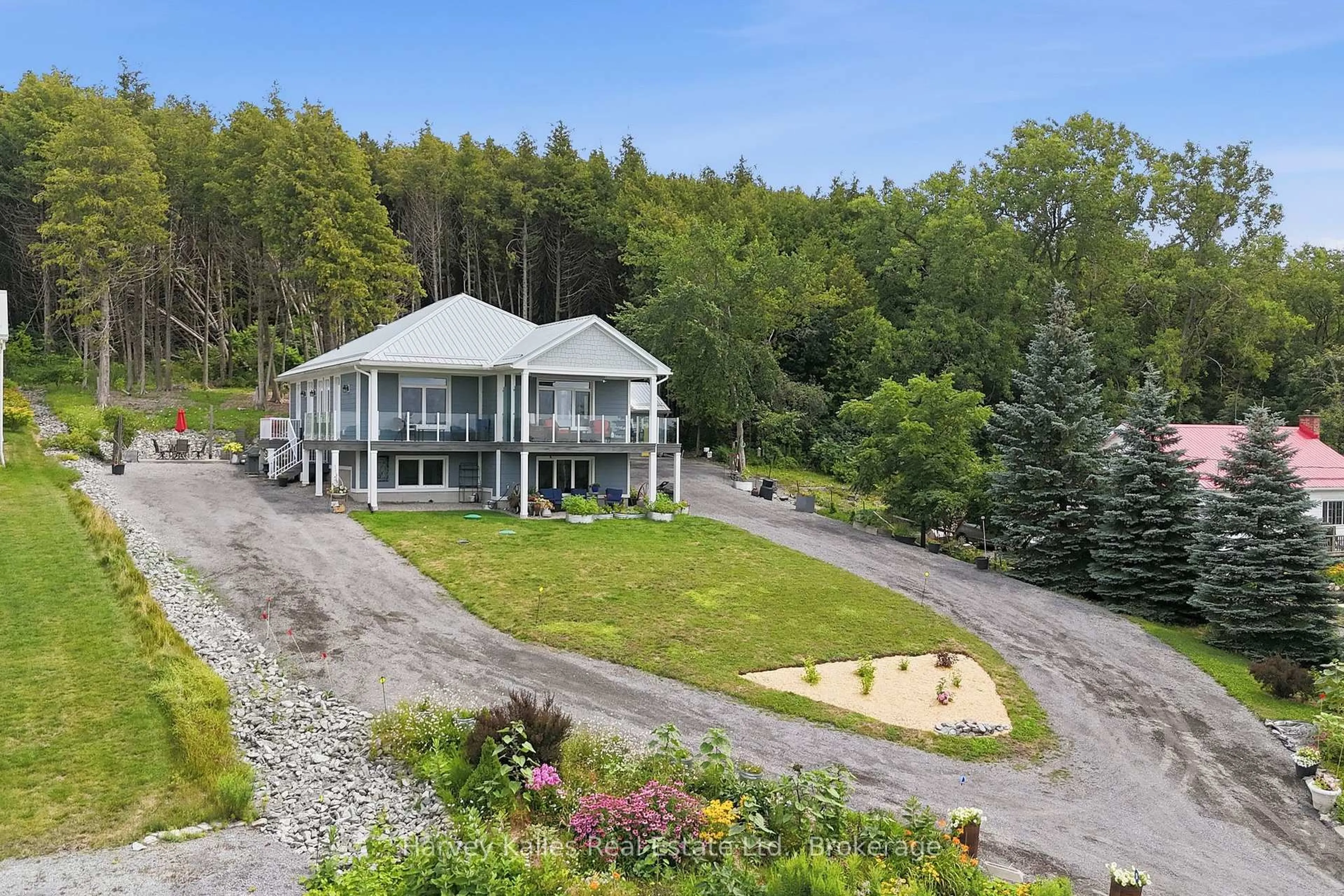A pic from outside/outdoor area/front of a property/back of a property/a pic from drone, mountain view for 12399 Loyalist Pkwy, Prince Edward County Ontario K0K 2T0