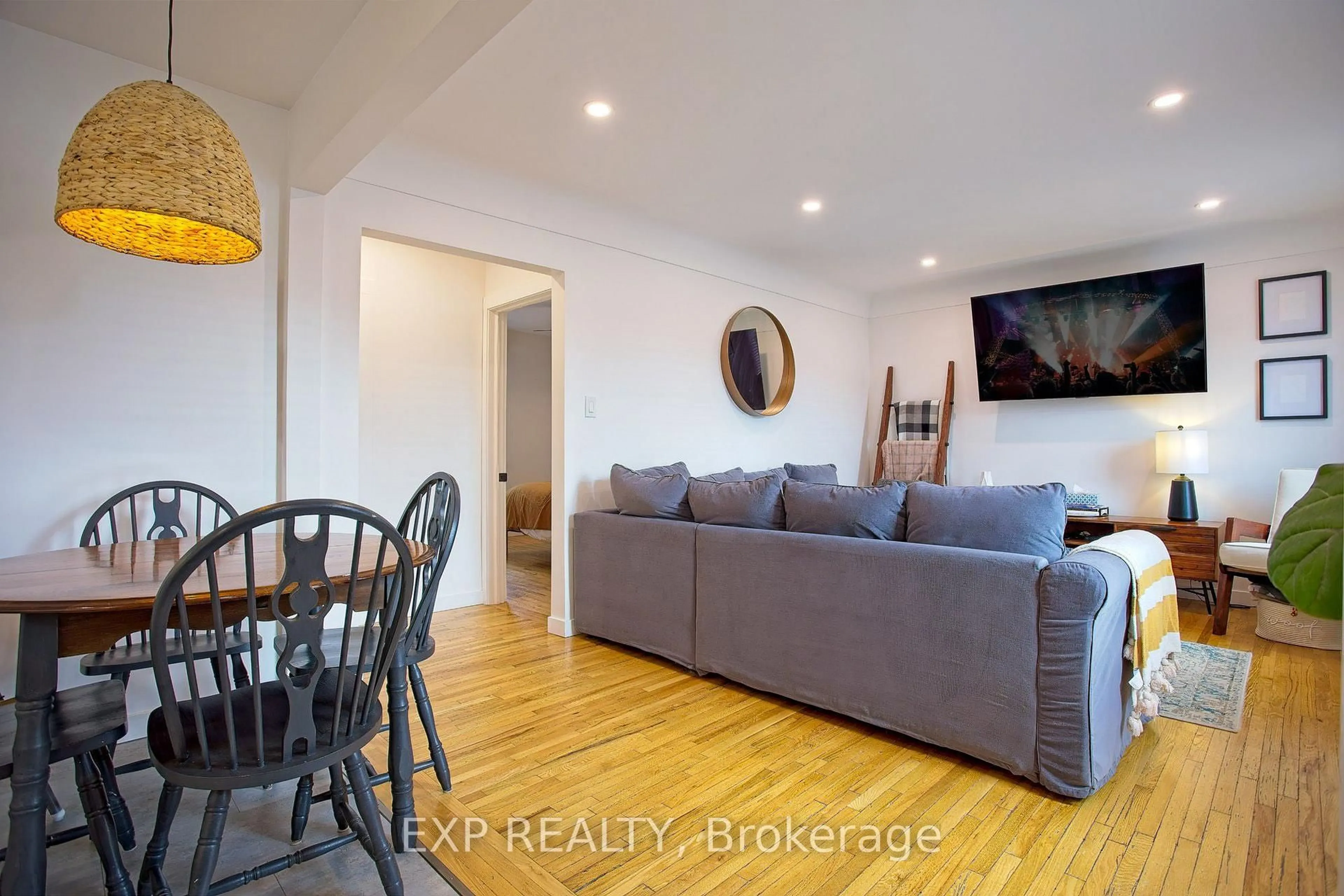 Living room with furniture, wood/laminate floor for 22 East 11th St, Hamilton Ontario L9A 3T2