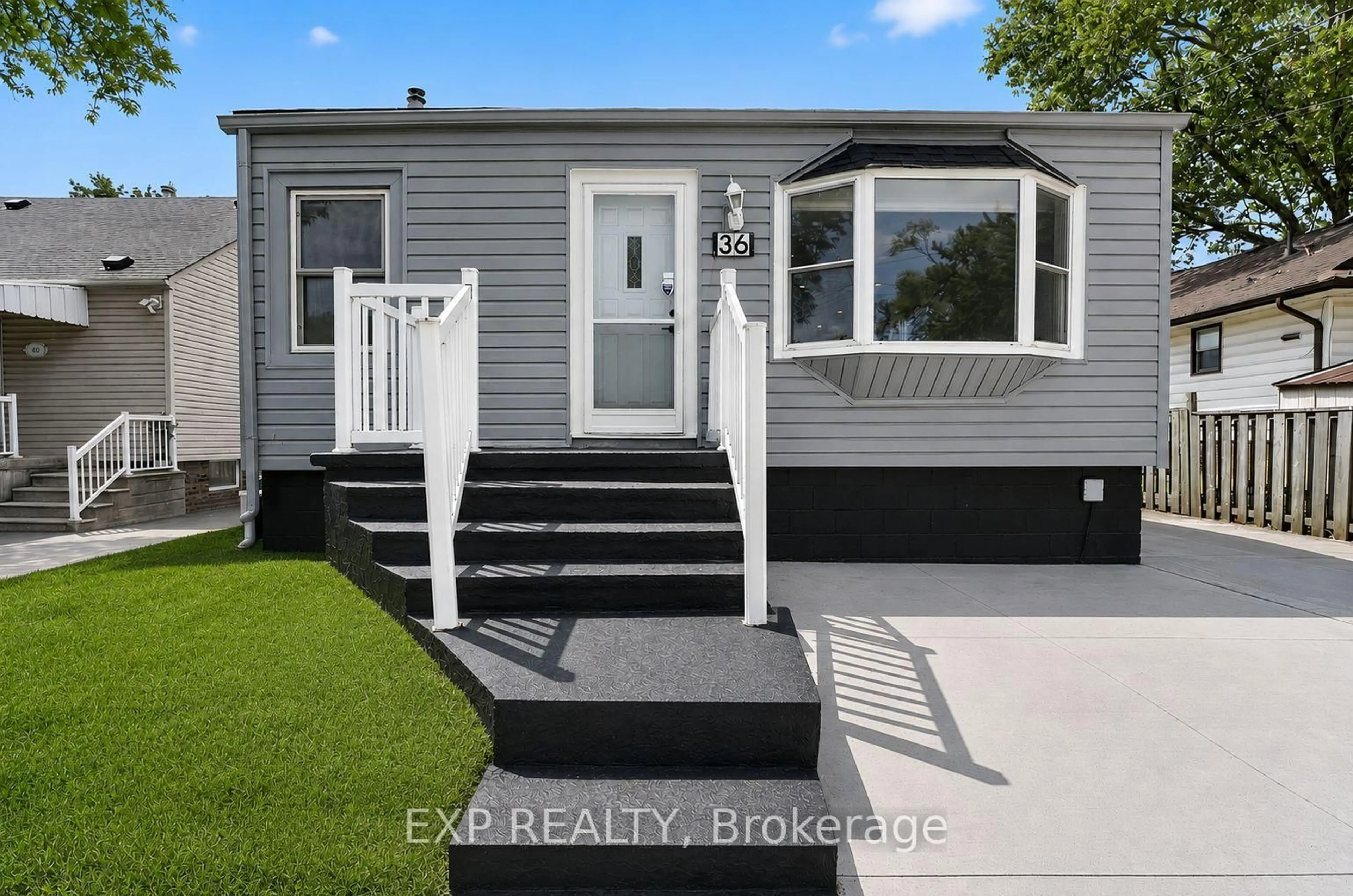 Home with vinyl exterior material, street for 36 Mahony Ave, Hamilton Ontario L8H 3C5