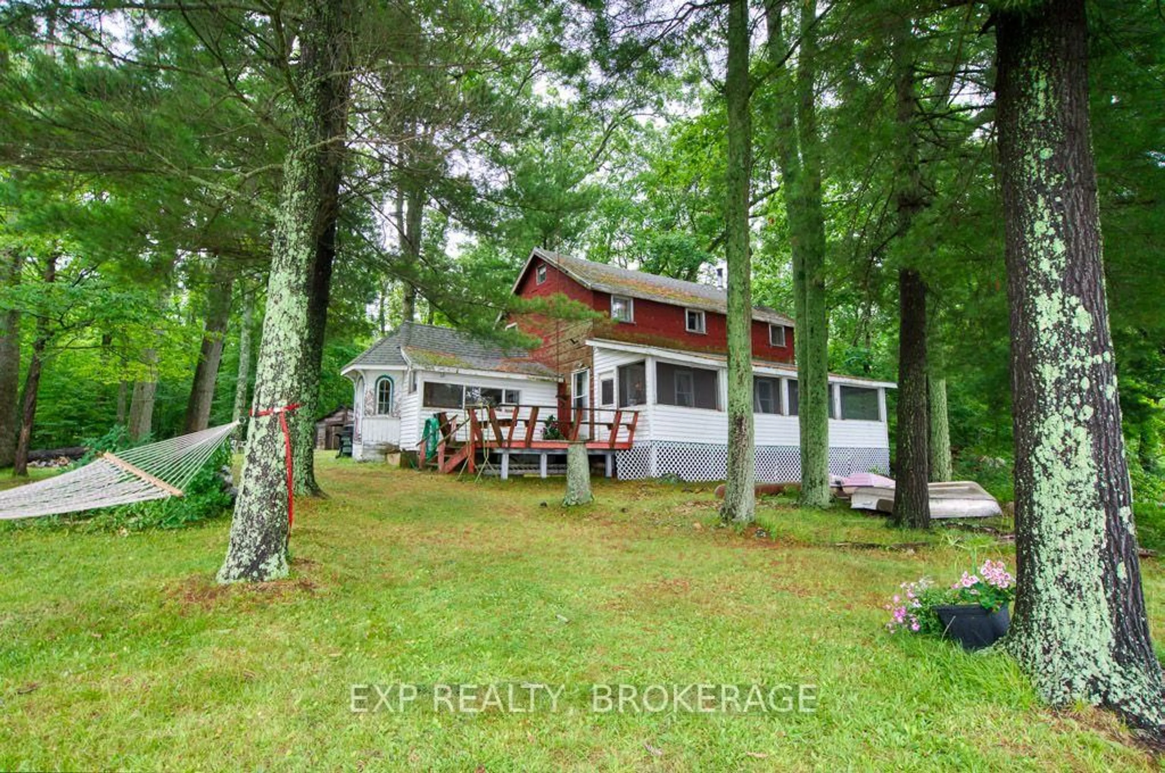 A pic from outside/outdoor area/front of a property/back of a property/a pic from drone, forest/trees view for 148B Oak Shores Lane, Tichborne Ontario K0H 2V0