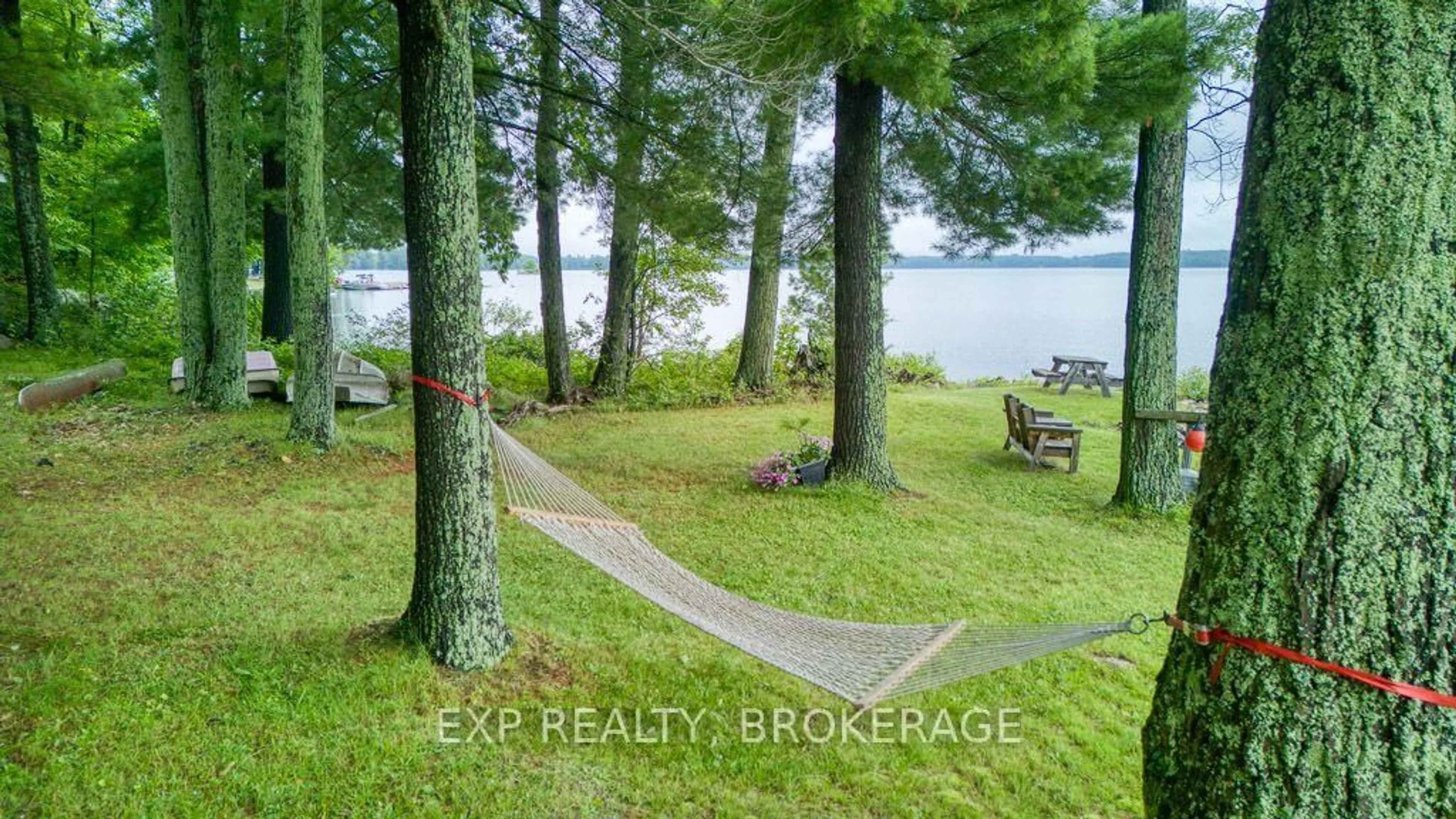A pic from outside/outdoor area/front of a property/back of a property/a pic from drone, water/lake/river/ocean view for 148B Oak Shores Lane, Tichborne Ontario K0H 2V0