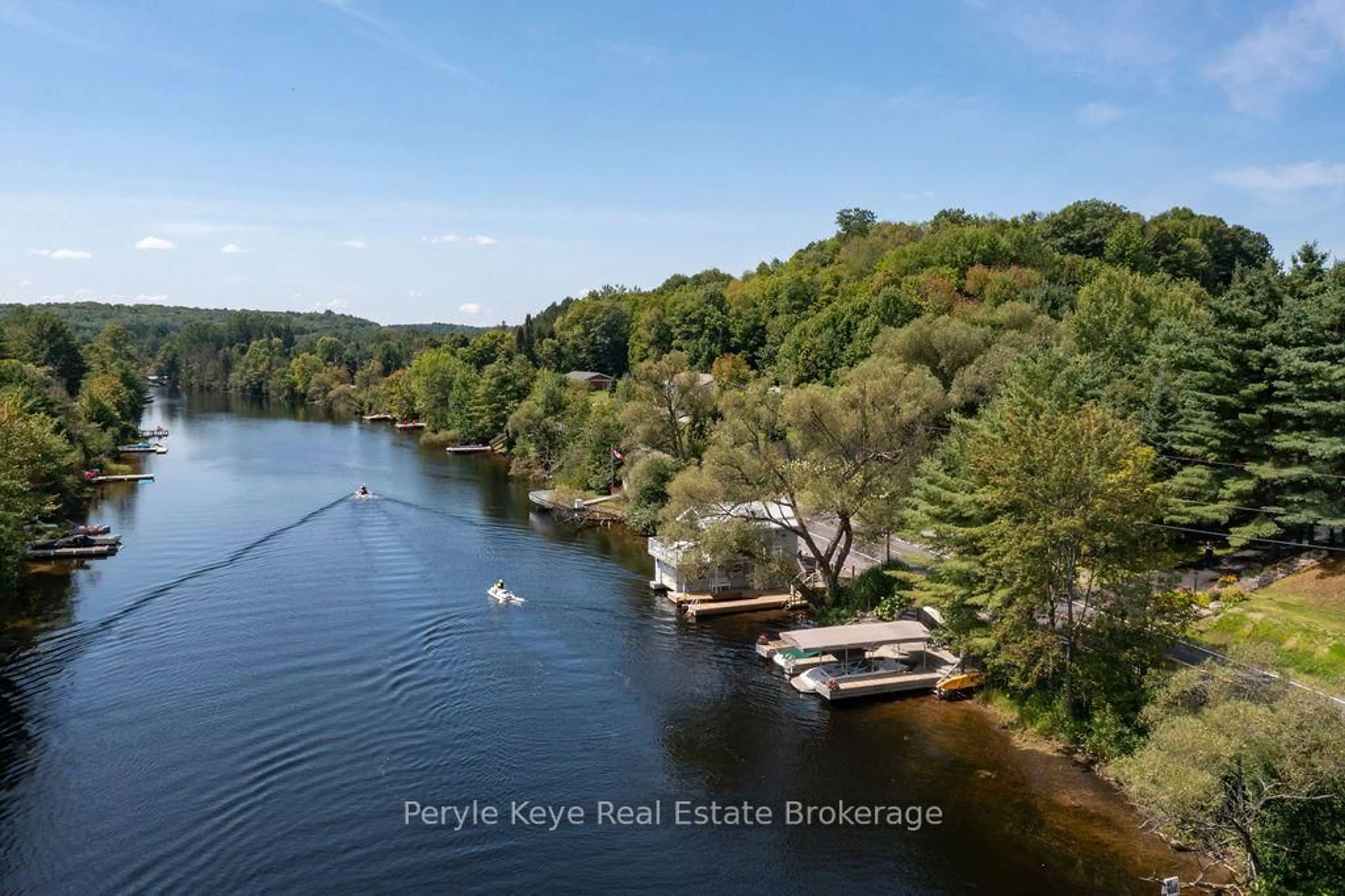 A pic from outside/outdoor area/front of a property/back of a property/a pic from drone, water/lake/river/ocean view for 179 Santa's Village Rd, Bracebridge Ontario P1L 0N3