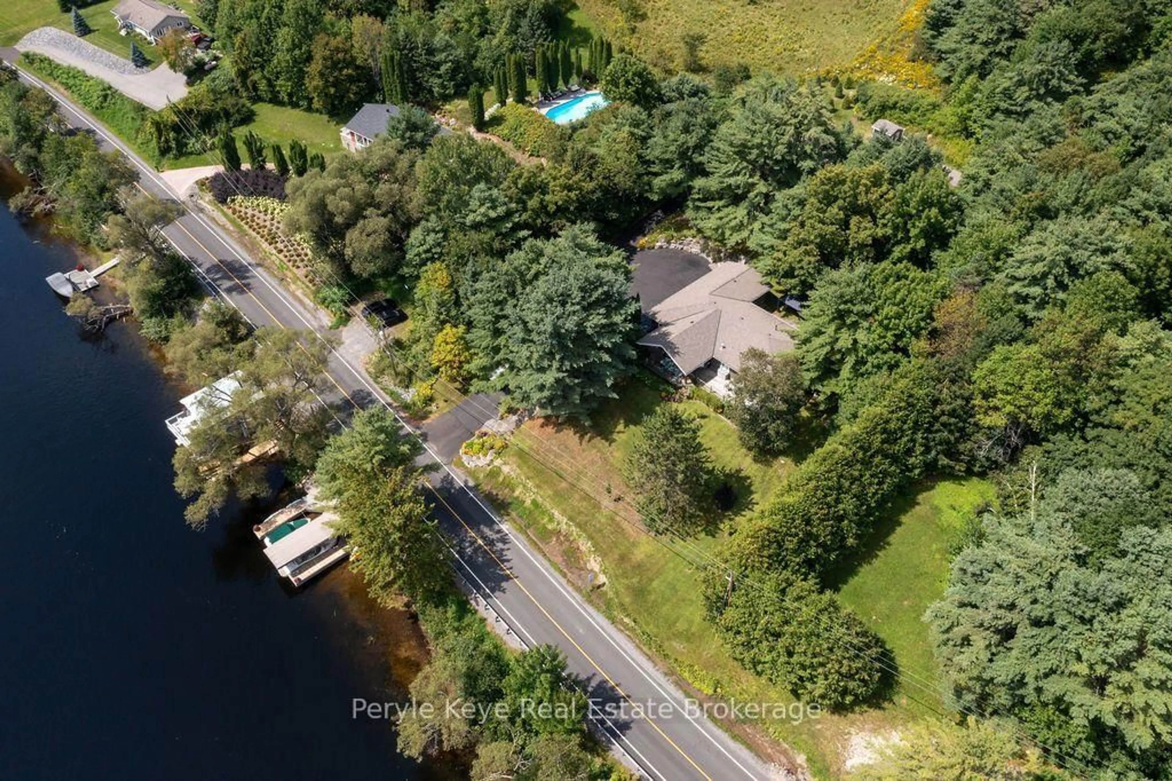 A pic from outside/outdoor area/front of a property/back of a property/a pic from drone, water/lake/river/ocean view for 179 Santa's Village Rd, Bracebridge Ontario P1L 0N3