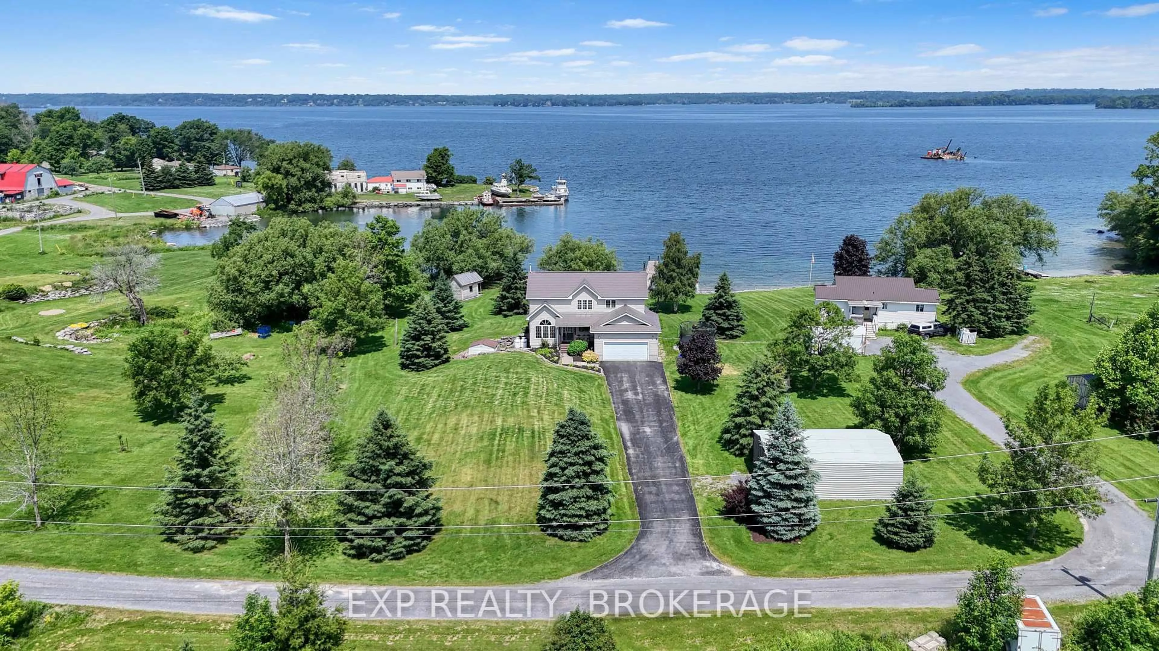 A pic from outside/outdoor area/front of a property/back of a property/a pic from drone, water/lake/river/ocean view for 26 BOXEN HARBOUR Lane, Wolfe Island Ontario K0H 2Y0