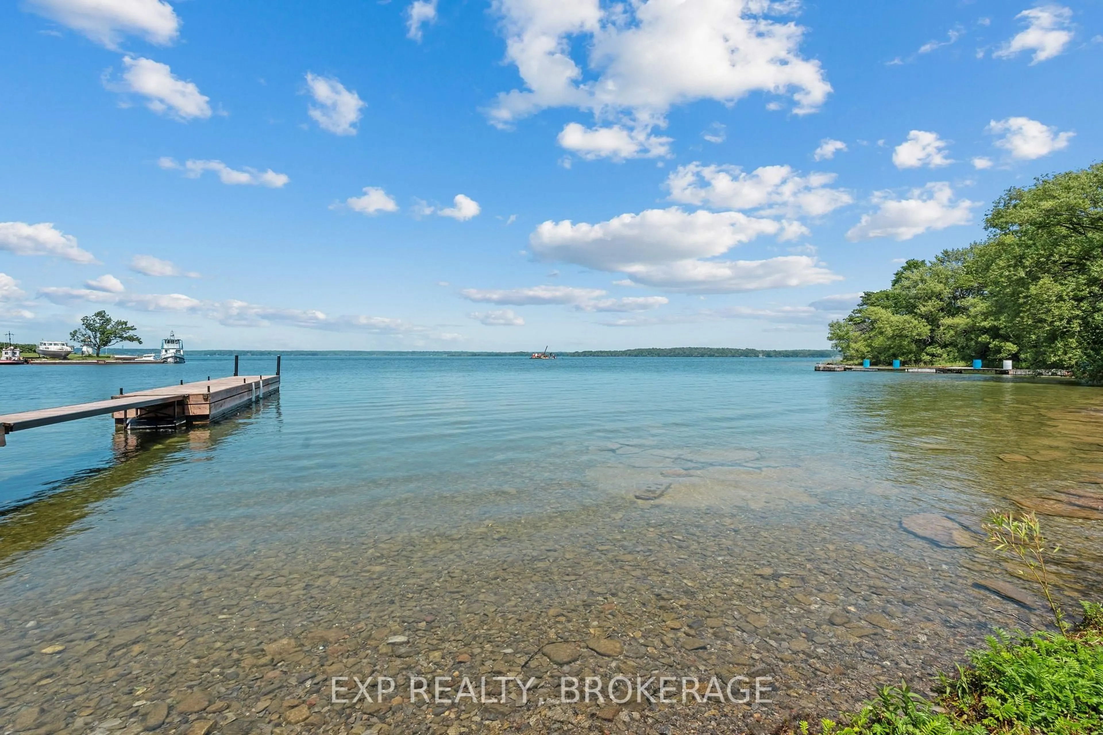 A pic from outside/outdoor area/front of a property/back of a property/a pic from drone, water/lake/river/ocean view for 26 BOXEN HARBOUR Lane, Wolfe Island Ontario K0H 2Y0