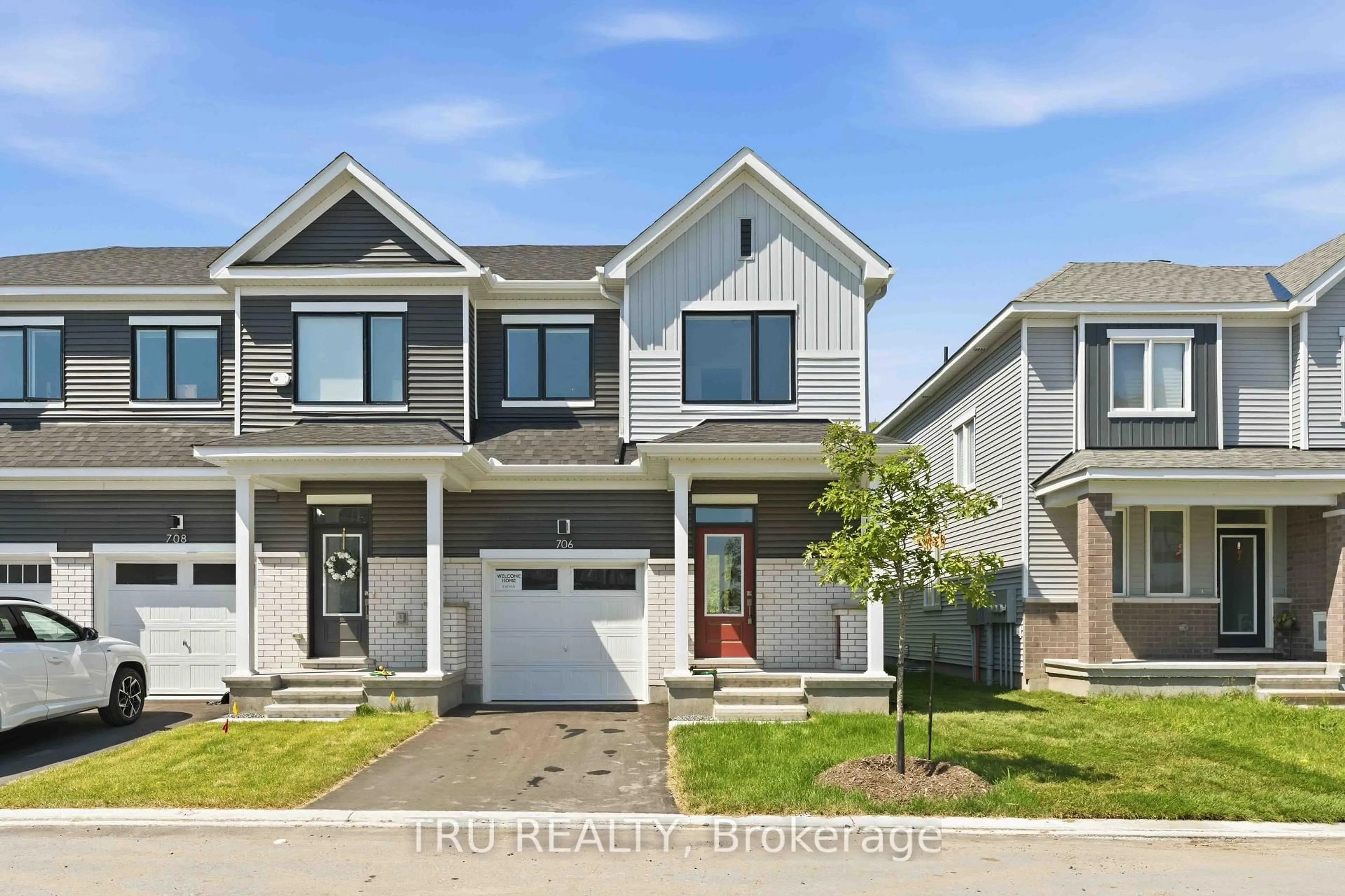 Home with vinyl exterior material, street for 706 Expansion Rd, Barrhaven Ontario K2J 7G4