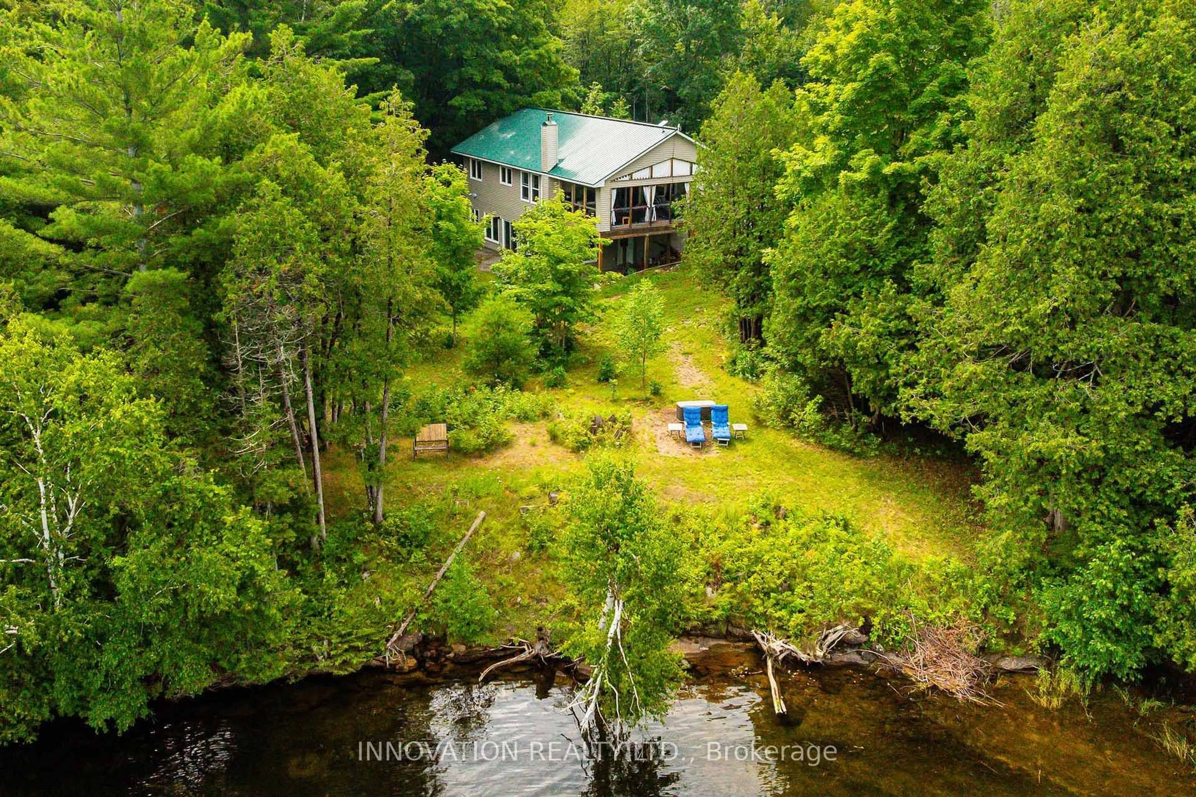 A pic from outside/outdoor area/front of a property/back of a property/a pic from drone, water/lake/river/ocean view for 688 Dewitt Lane, Godfrey Ontario K0H 1T0