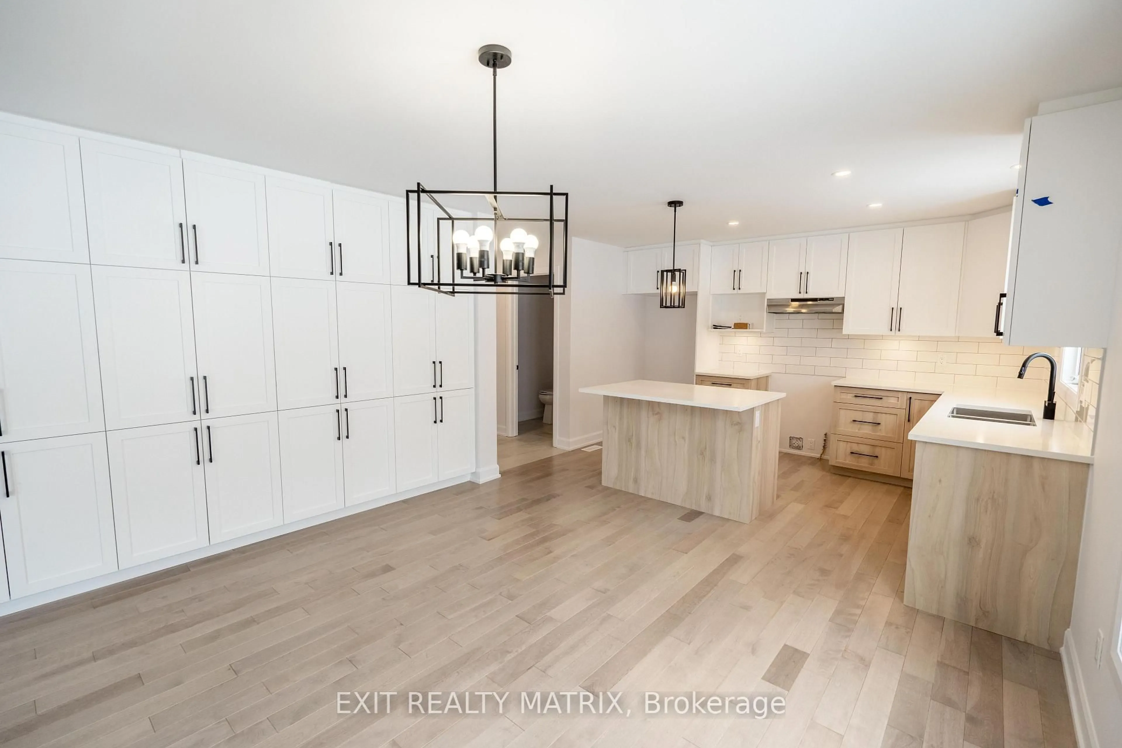 Open concept kitchen, wood/laminate floor for 18 Glenco Rd, South Stormont Ontario K0C 2A0