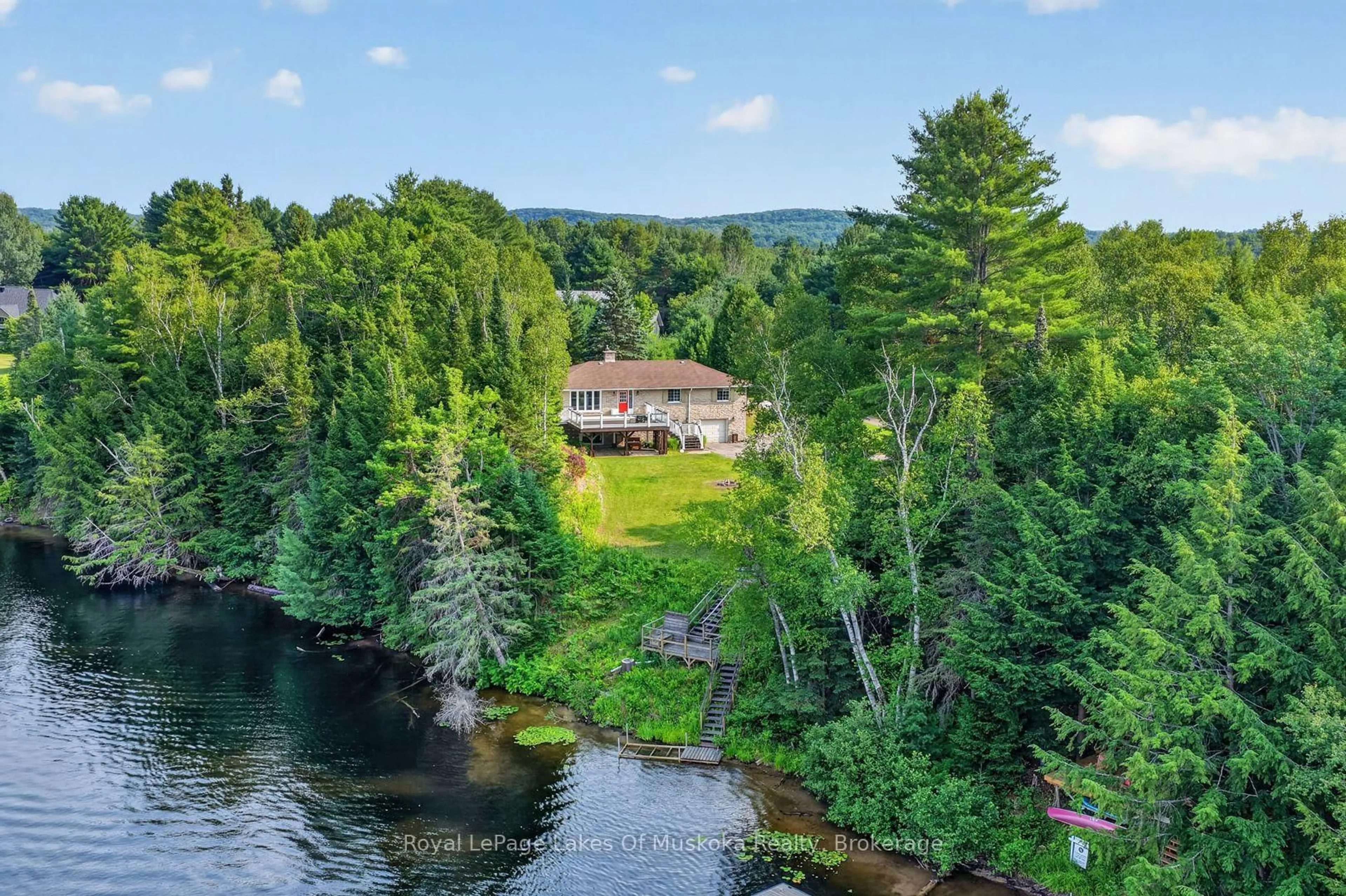A pic from outside/outdoor area/front of a property/back of a property/a pic from drone, water/lake/river/ocean view for 44 Shellwood Shores Ave, Huntsville Ontario P1H 2M4
