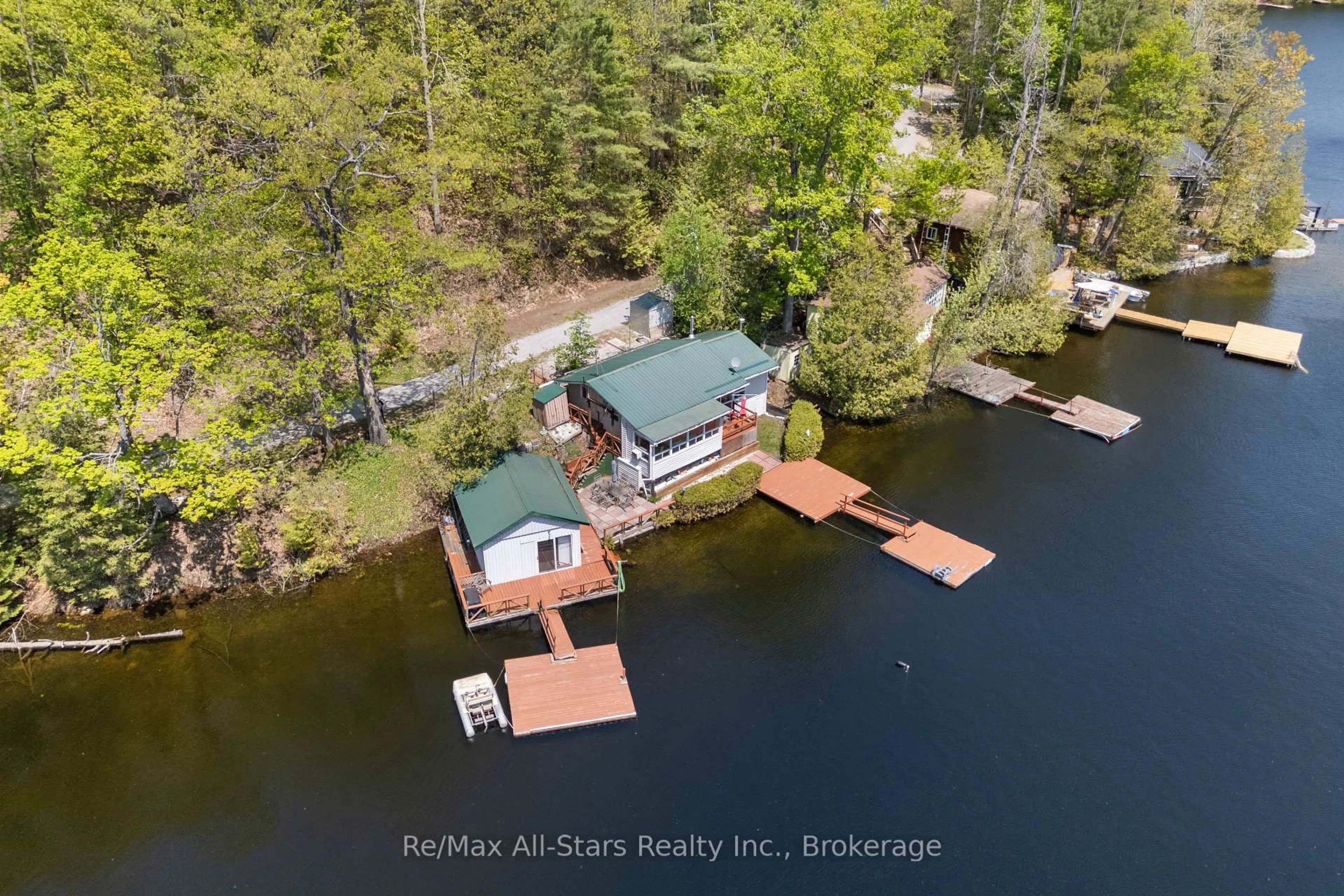 A pic from outside/outdoor area/front of a property/back of a property/a pic from drone, water/lake/river/ocean view for 55 Fire Route 393, Trent Lakes Ontario K0M 2A0