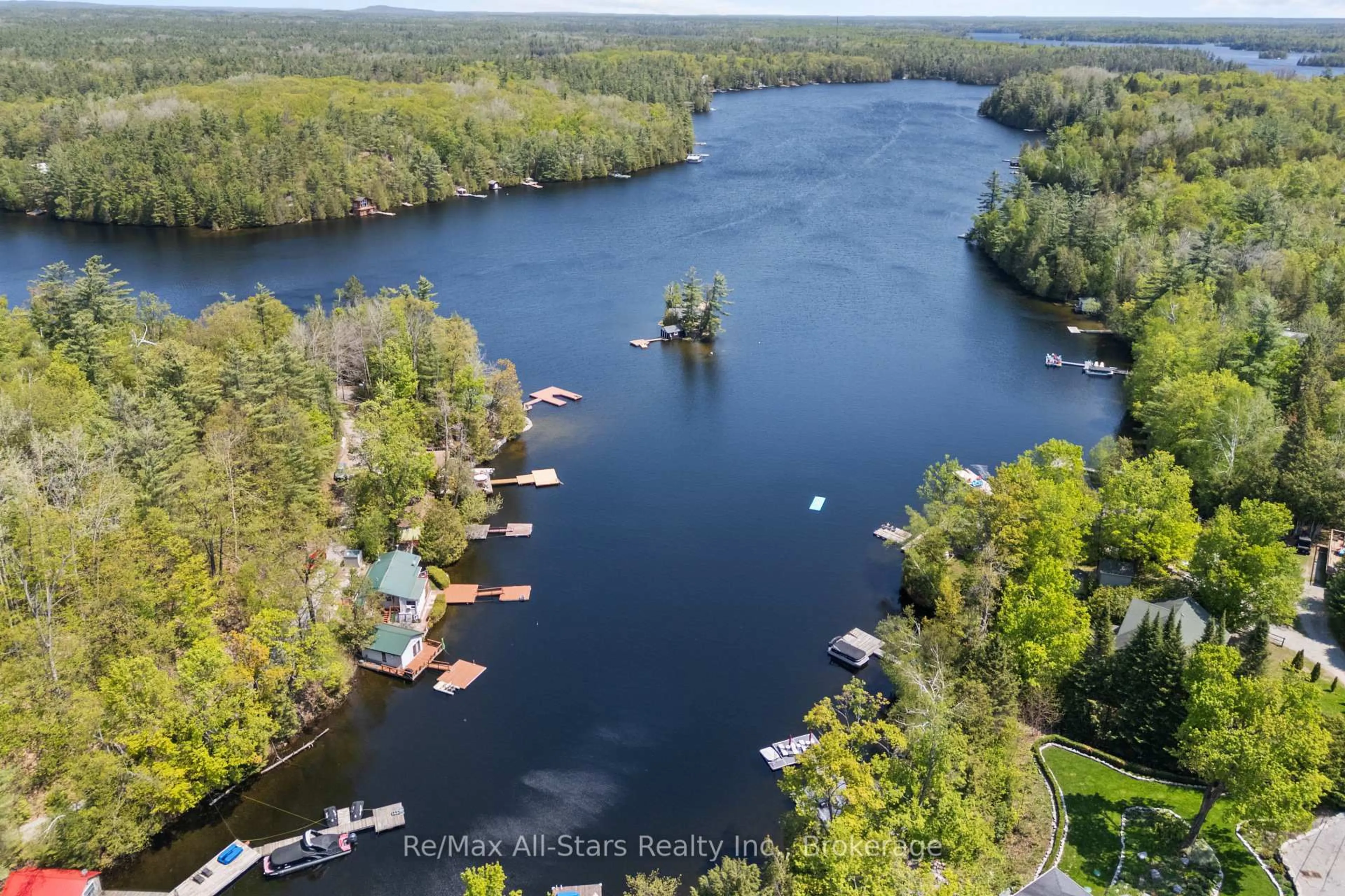 A pic from outside/outdoor area/front of a property/back of a property/a pic from drone, water/lake/river/ocean view for 55 Fire Route 393, Trent Lakes Ontario K0M 2A0