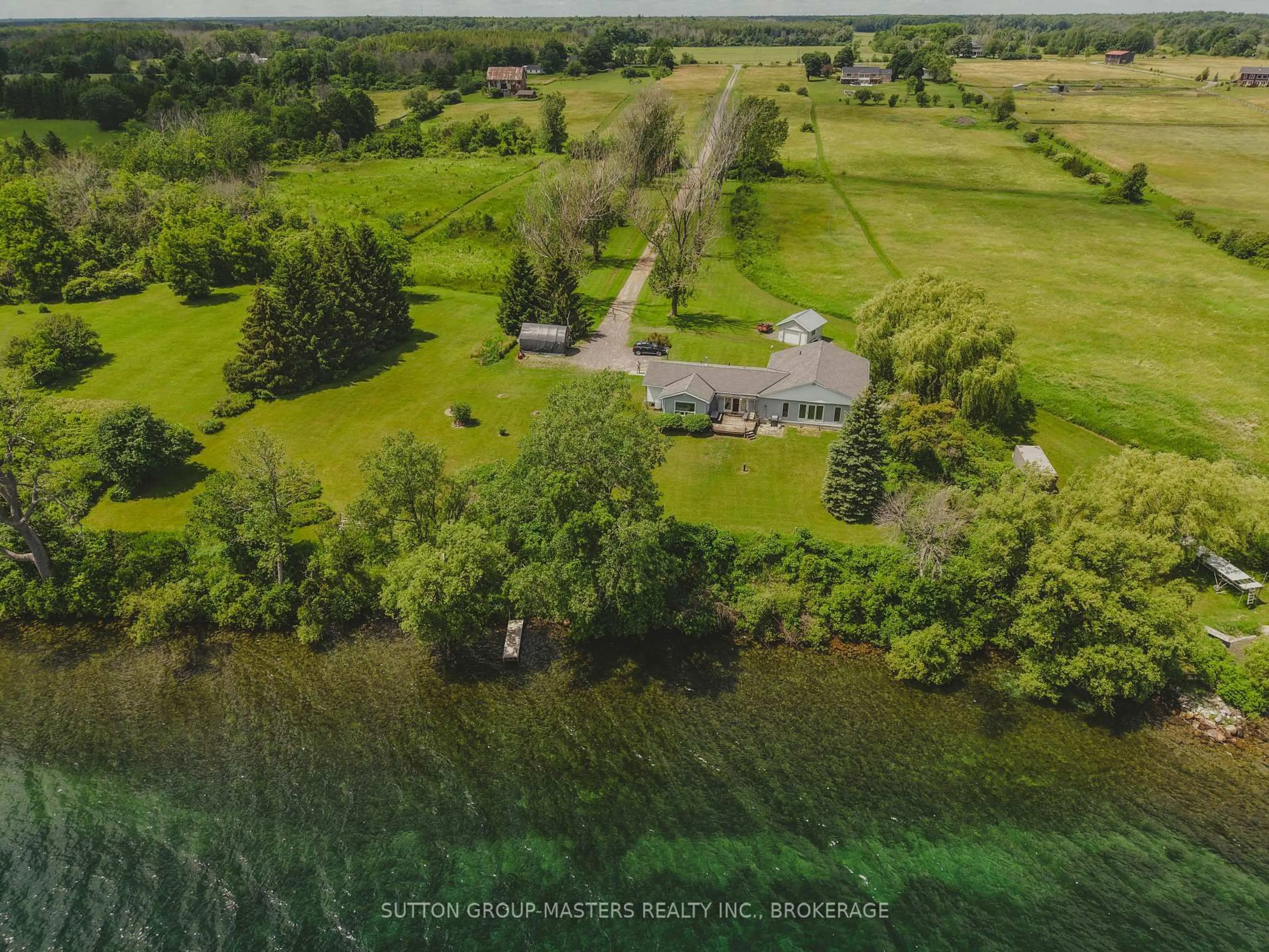 A pic from outside/outdoor area/front of a property/back of a property/a pic from drone, water/lake/river/ocean view for 9392 Highway 33 Highway, Bath Ontario K0H 1G0