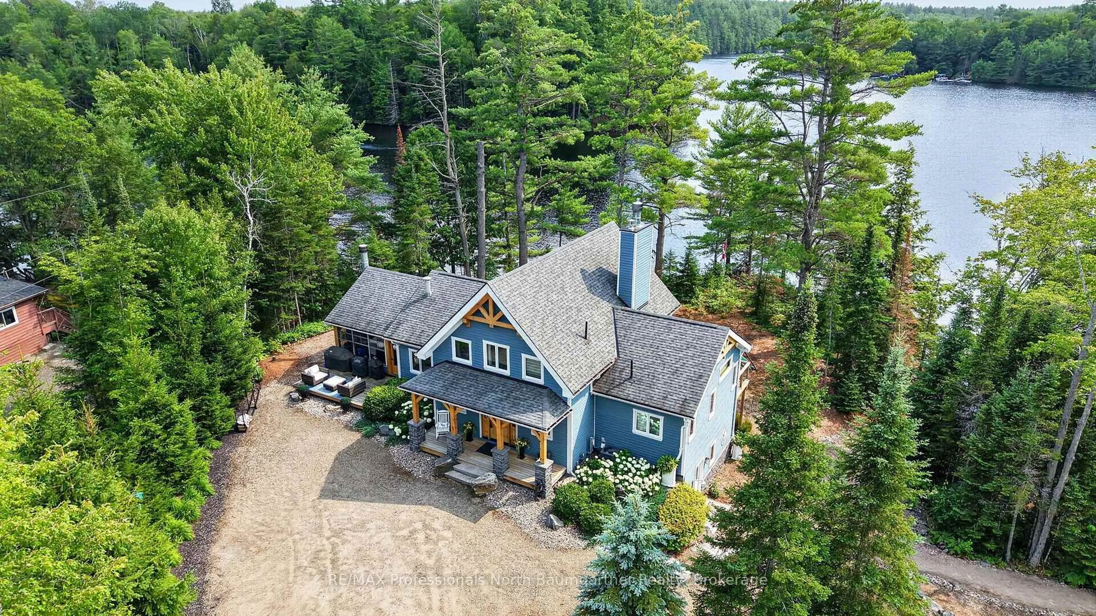 A pic from outside/outdoor area/front of a property/back of a property/a pic from drone, water/lake/river/ocean view for 1038 Chicory Dr, Dysart et al Ontario K0M 1S0