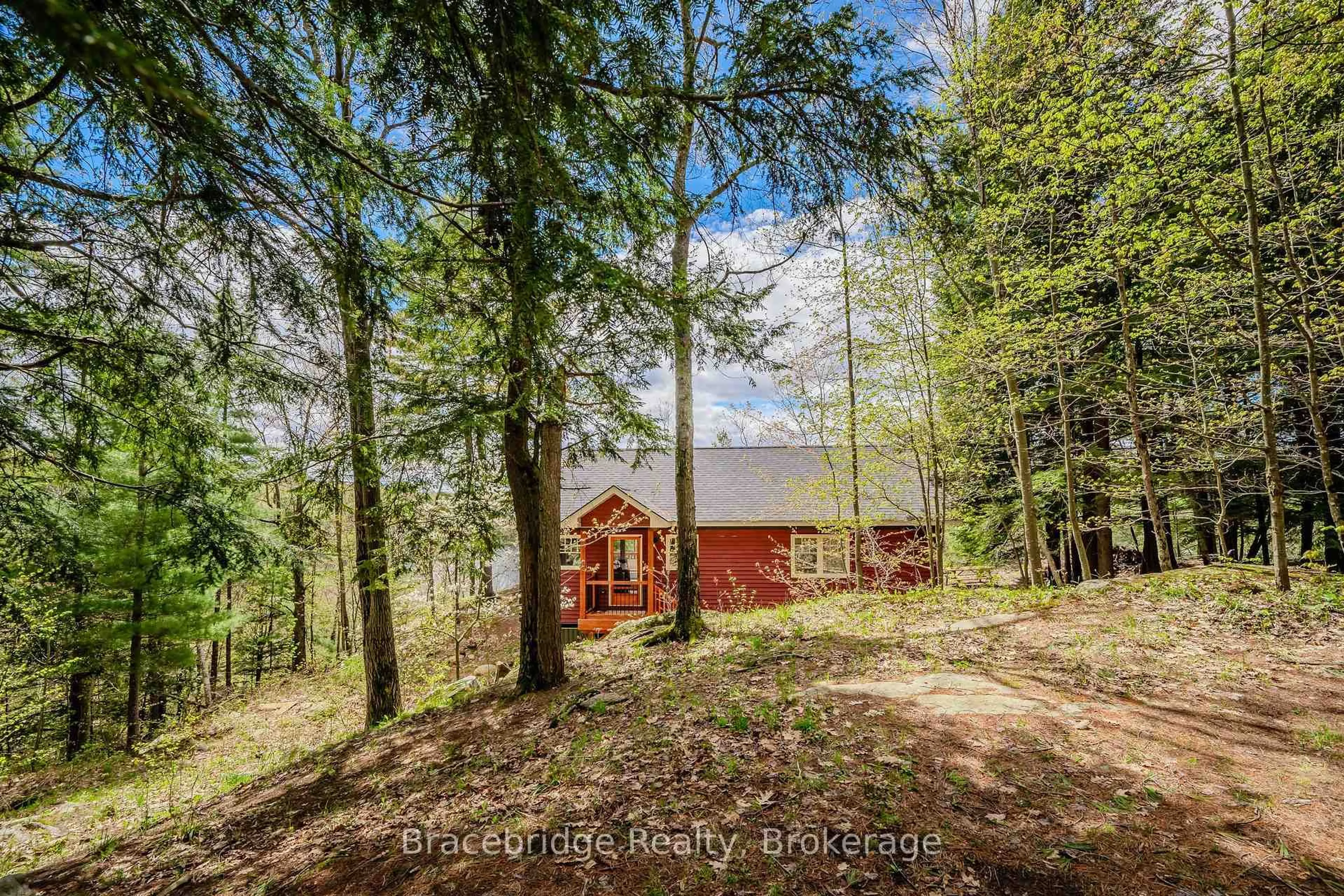 A pic from outside/outdoor area/front of a property/back of a property/a pic from drone, forest/trees view for 27 Beaumont Bay Rd, Muskoka Lakes Ontario P0B 1L0