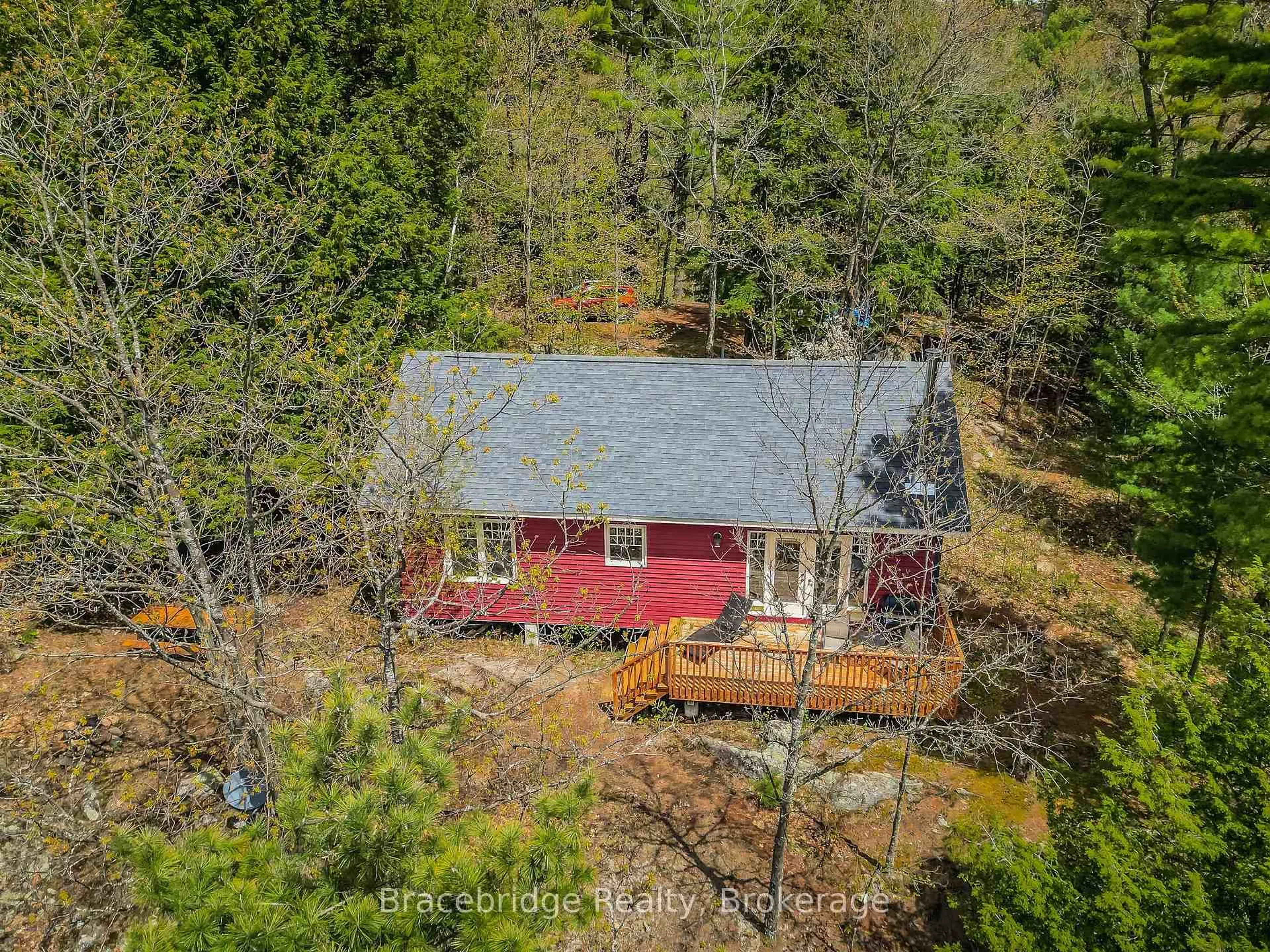A pic from outside/outdoor area/front of a property/back of a property/a pic from drone, forest/trees view for 27 Beaumont Bay Rd, Muskoka Lakes Ontario P0B 1L0