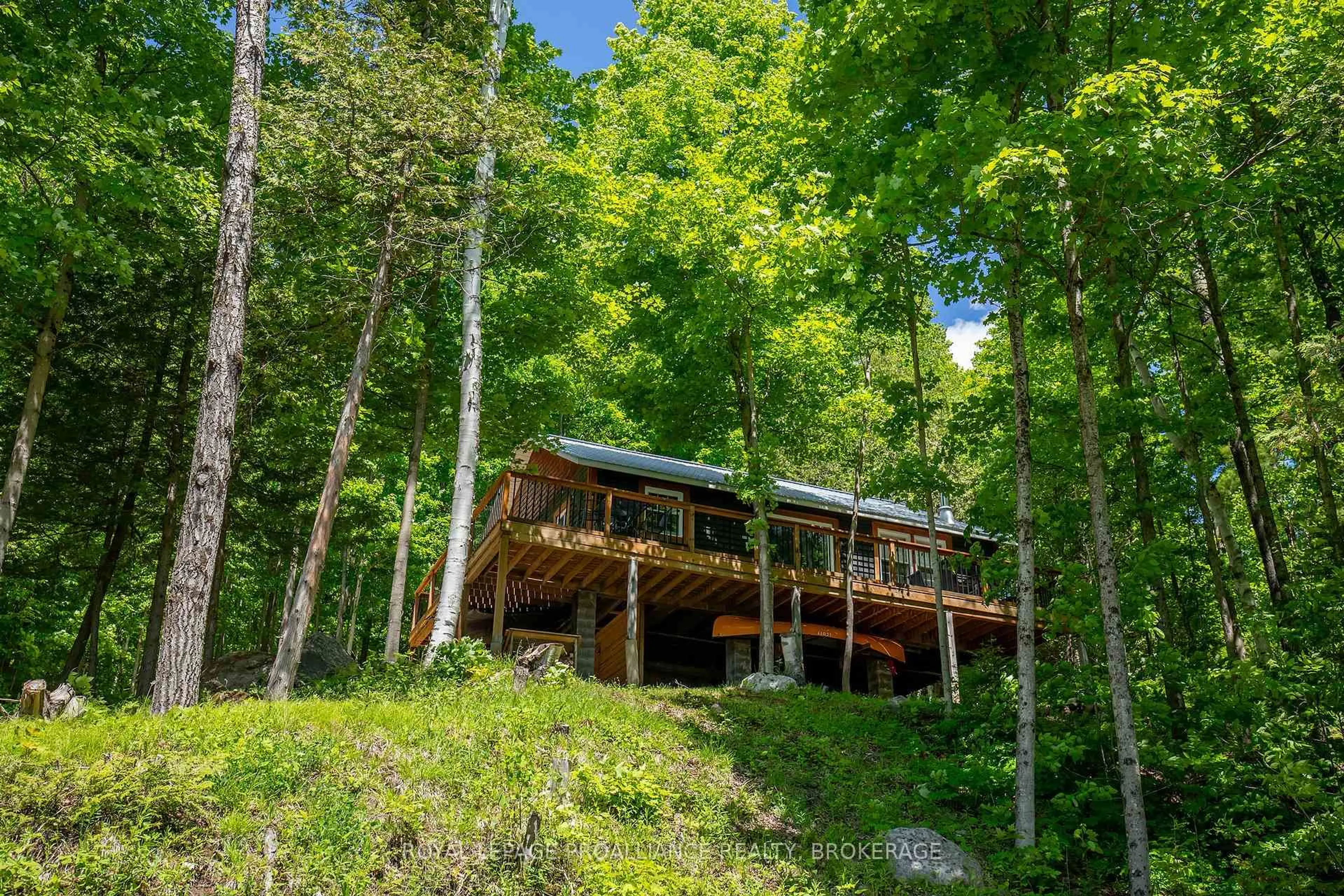 A pic from outside/outdoor area/front of a property/back of a property/a pic from drone, forest/trees view for 1101 Price Rd, Arden Ontario K0H 1B0