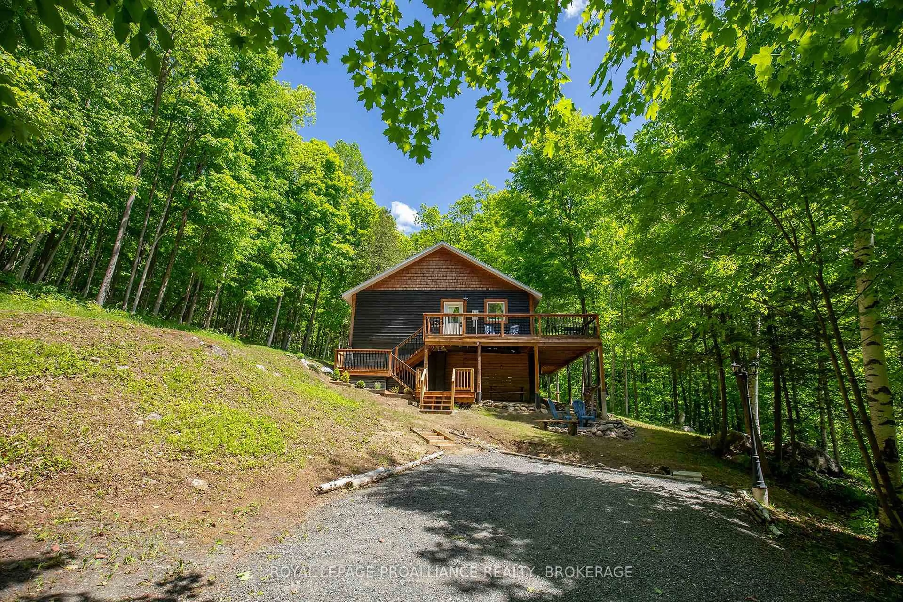 A pic from outside/outdoor area/front of a property/back of a property/a pic from drone, forest/trees view for 1101 Price Rd, Arden Ontario K0H 1B0
