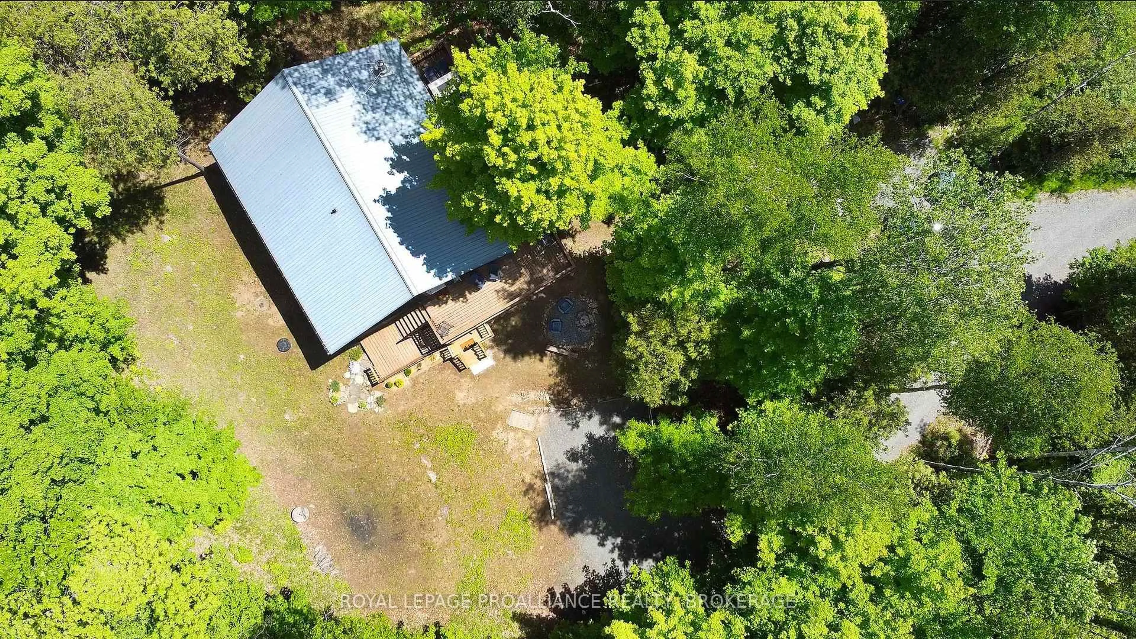 A pic from outside/outdoor area/front of a property/back of a property/a pic from drone, forest/trees view for 1101 Price Rd, Arden Ontario K0H 1B0