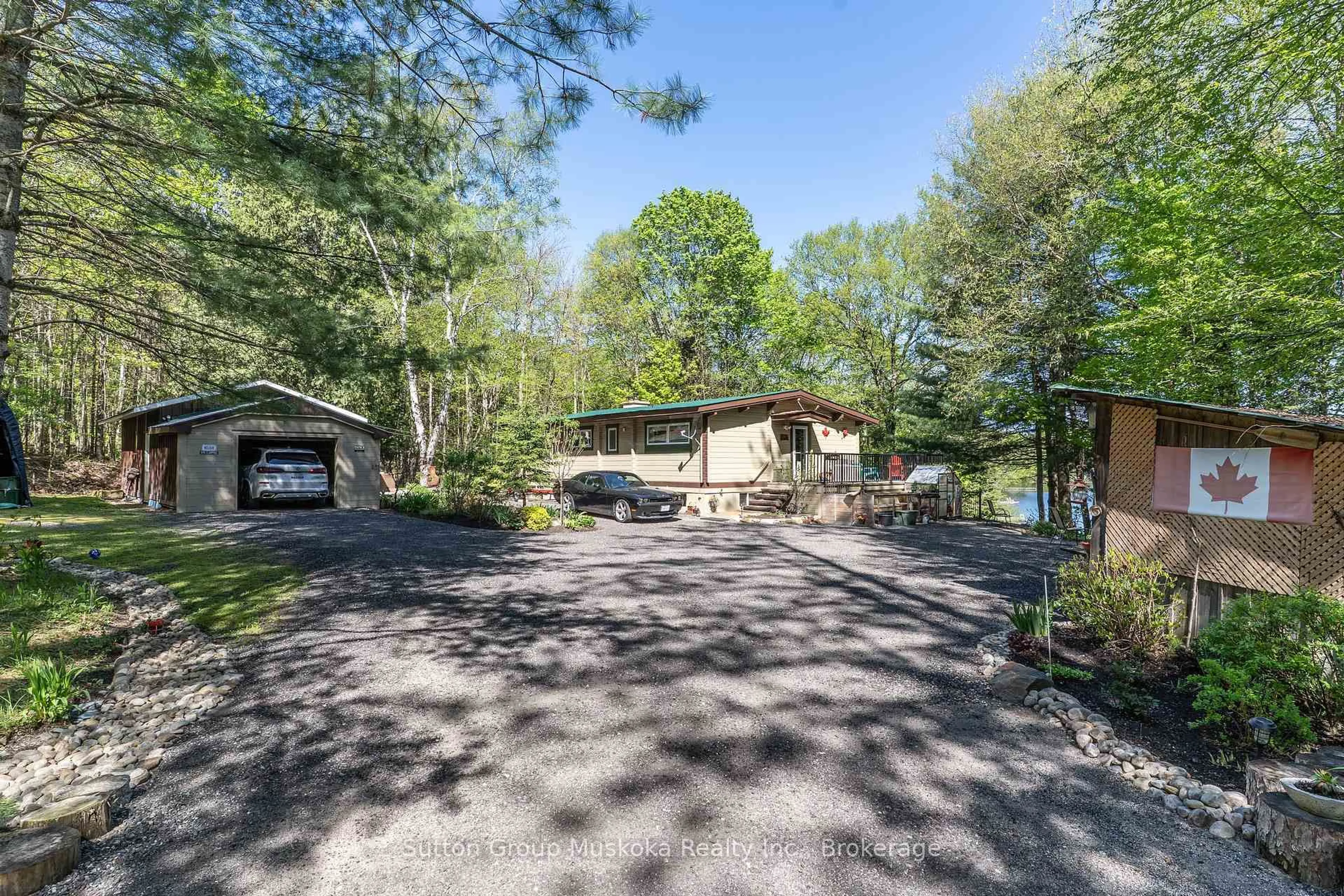 A pic from outside/outdoor area/front of a property/back of a property/a pic from drone, unknown for 236 Hoodstown Rd, Huntsville Ontario P1H 2J2