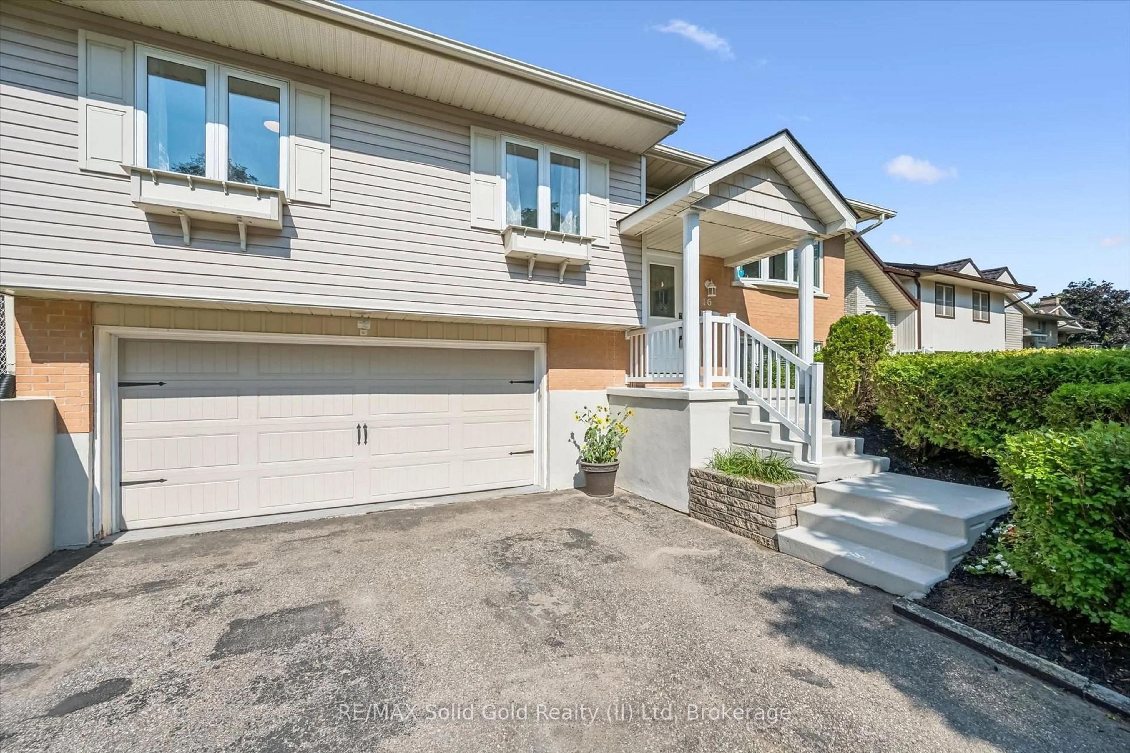 Home with vinyl exterior material, street for 16 Nipigon St, Kitchener Ontario N2B 3M3