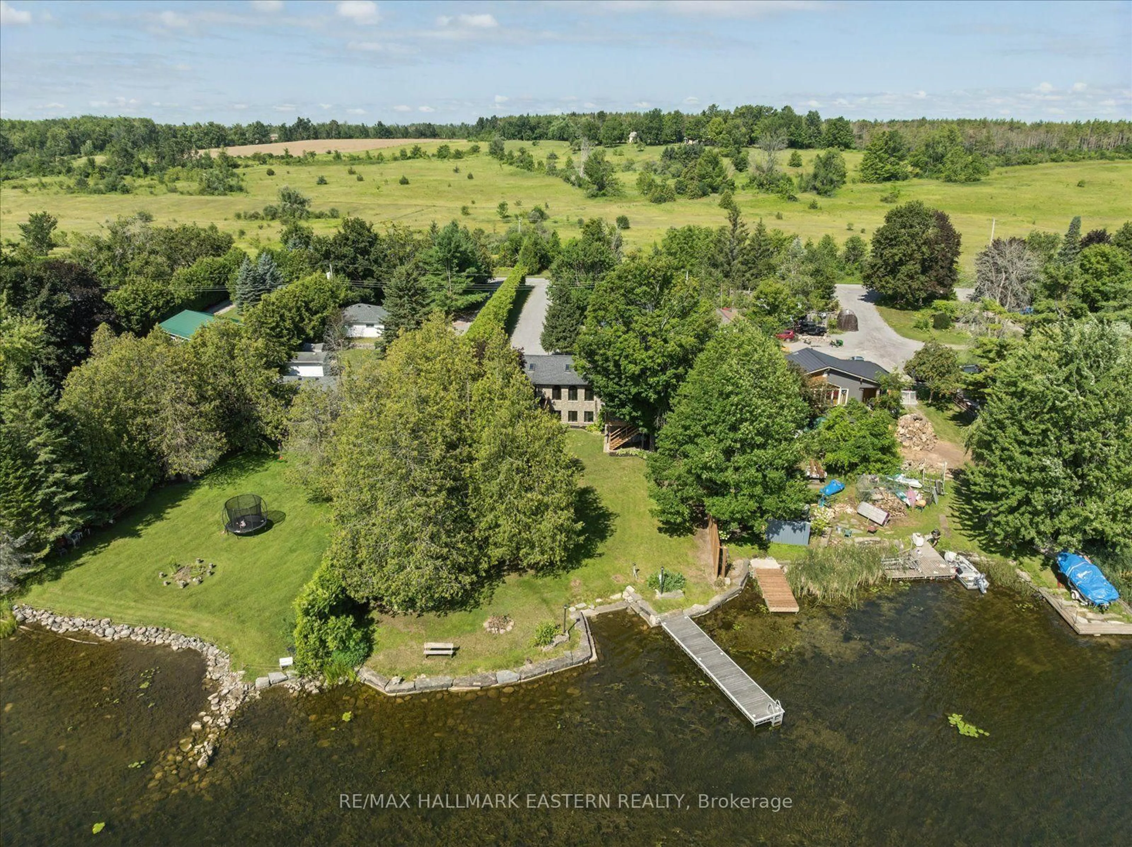 A pic from outside/outdoor area/front of a property/back of a property/a pic from drone, water/lake/river/ocean view for 1041 Primrose Lane, Selwyn Ontario K9J 6X5