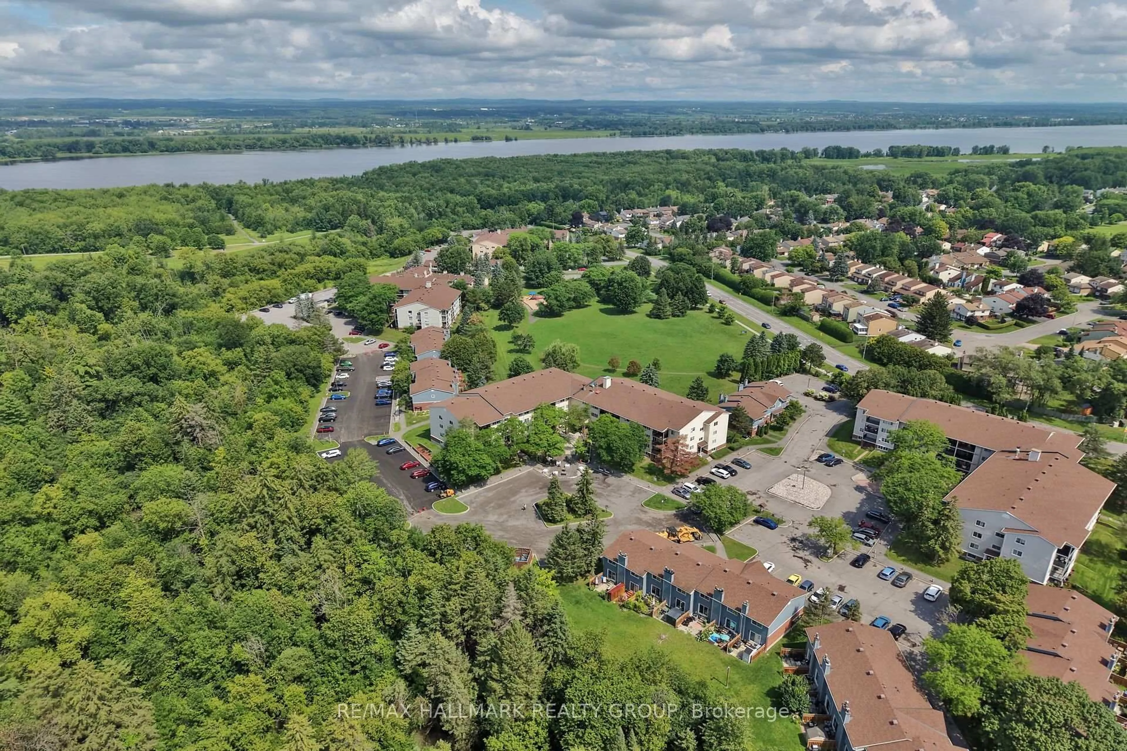 A pic from outside/outdoor area/front of a property/back of a property/a pic from drone, water/lake/river/ocean view for 6470 Bilberry Dr #306, Ottawa Ontario K1C 4P1
