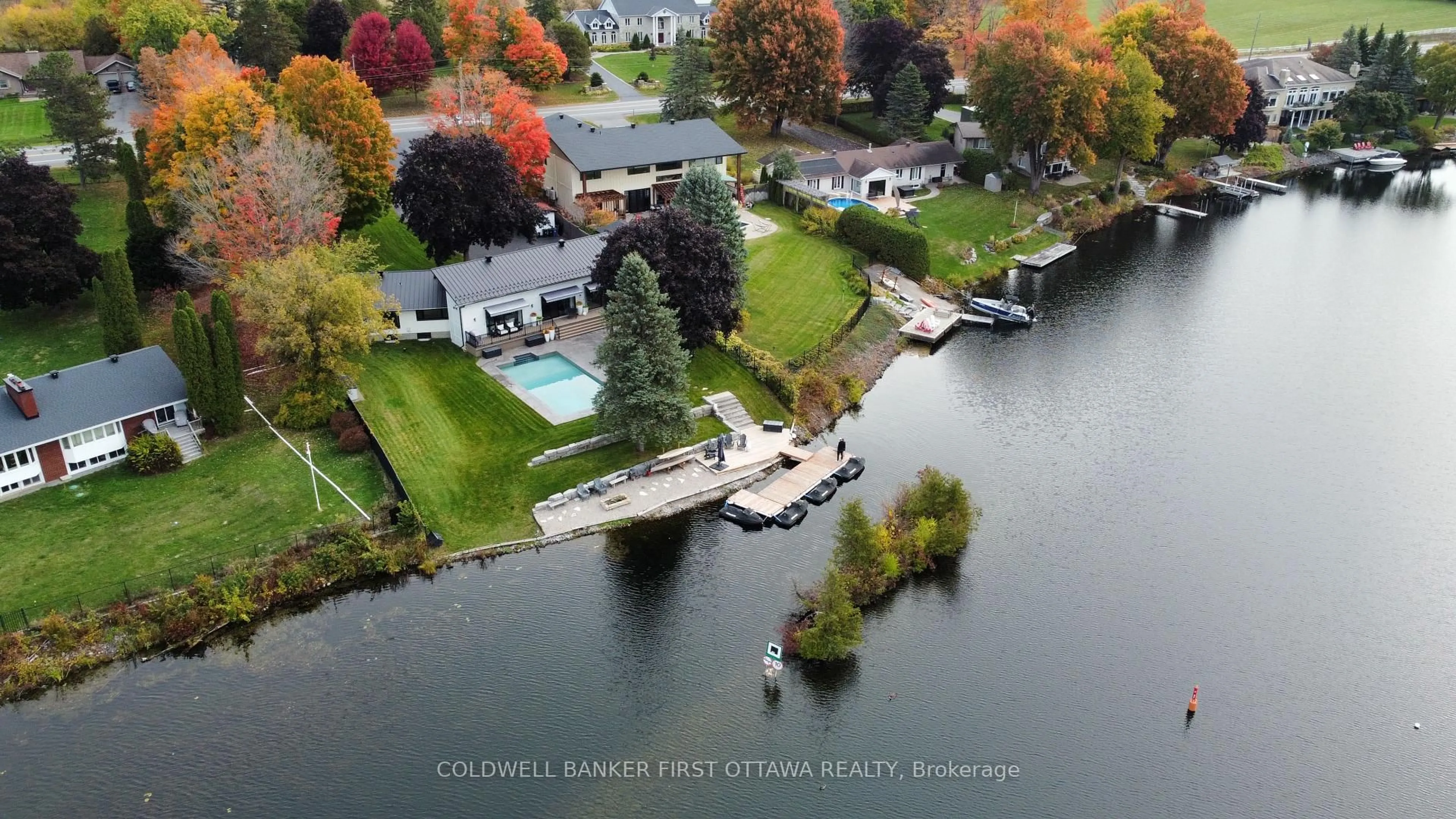 A pic from outside/outdoor area/front of a property/back of a property/a pic from drone, water/lake/river/ocean view for 1060 River Rd, Ottawa Ontario K4M 1B4