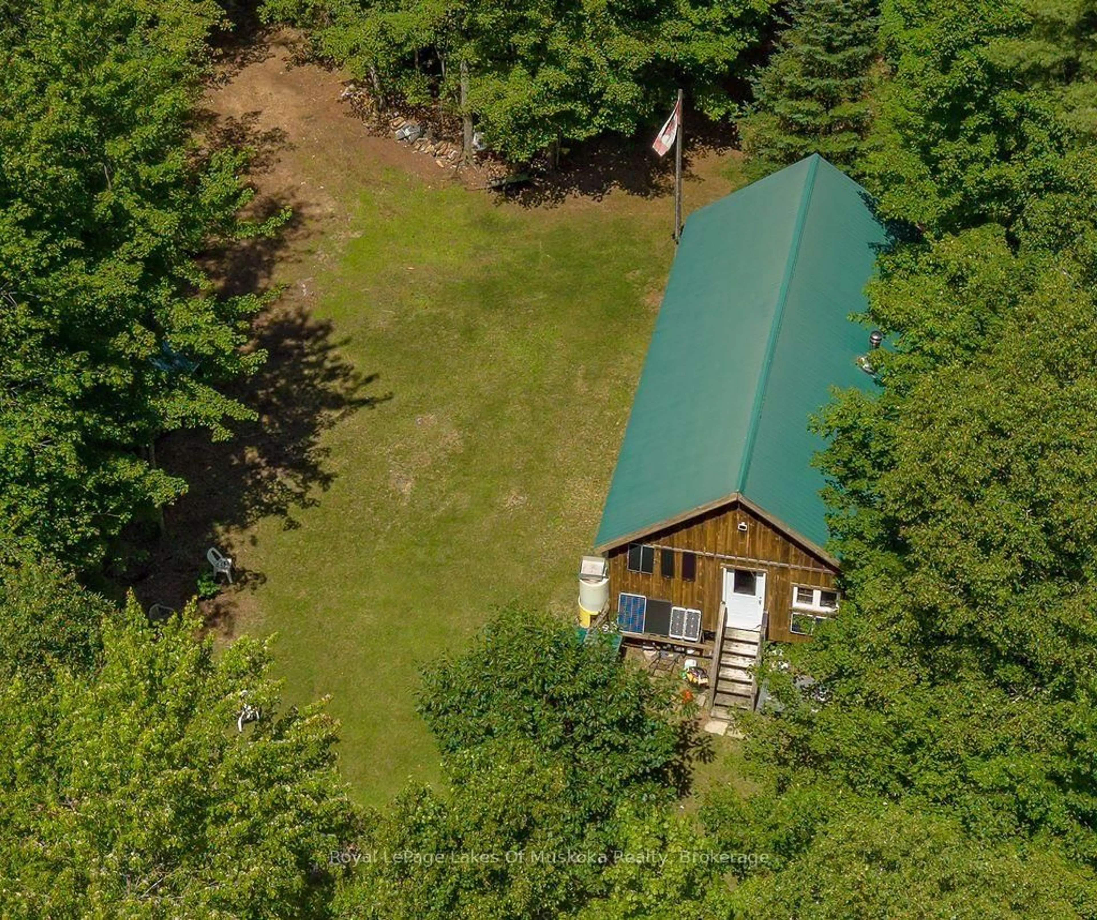 A pic from outside/outdoor area/front of a property/back of a property/a pic from drone, forest/trees view for 1101 Langford Rd, Lake of Bays Ontario P0B 1A0