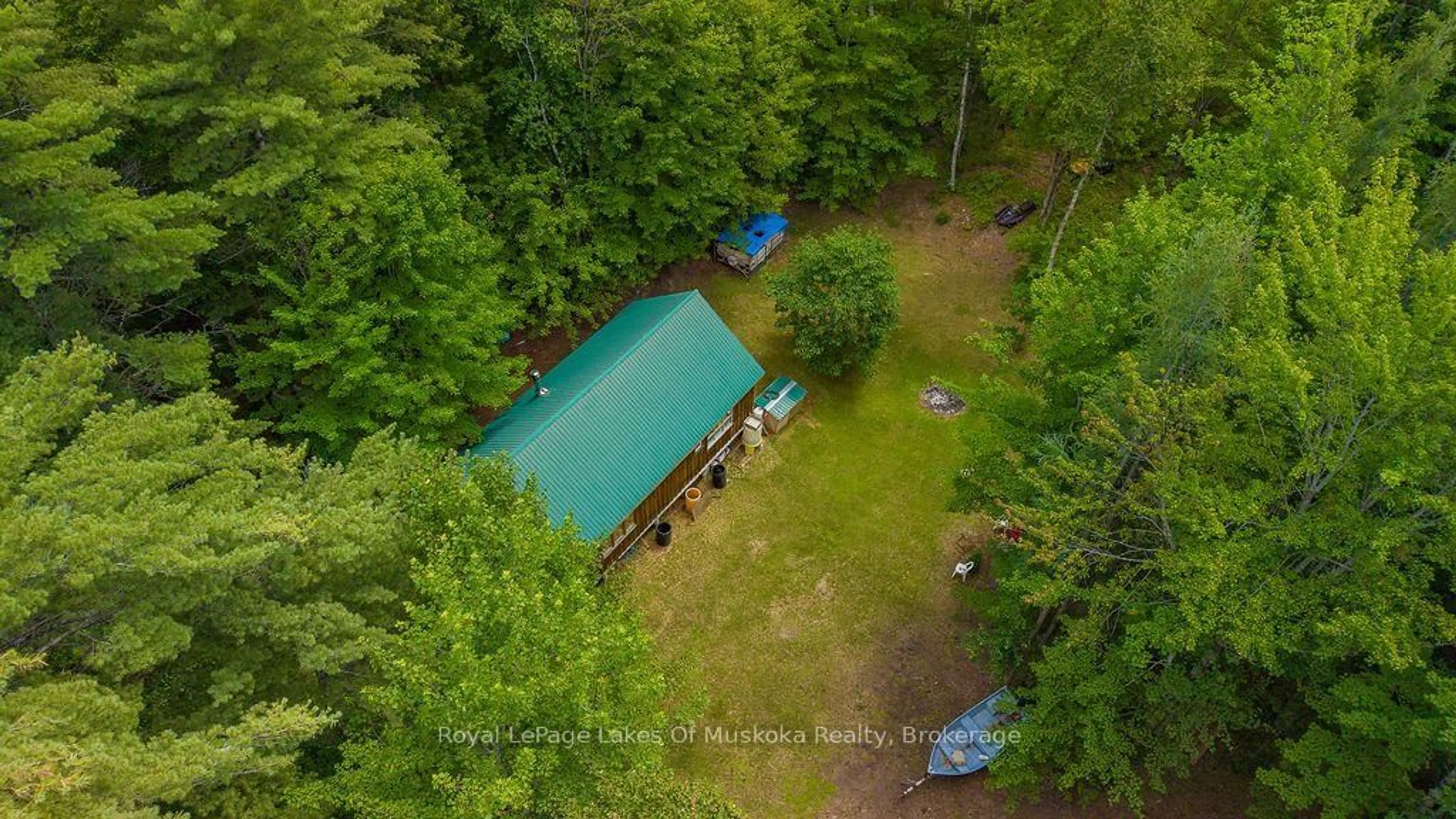A pic from outside/outdoor area/front of a property/back of a property/a pic from drone, forest/trees view for 1101 Langford Rd, Lake of Bays Ontario P0B 1A0