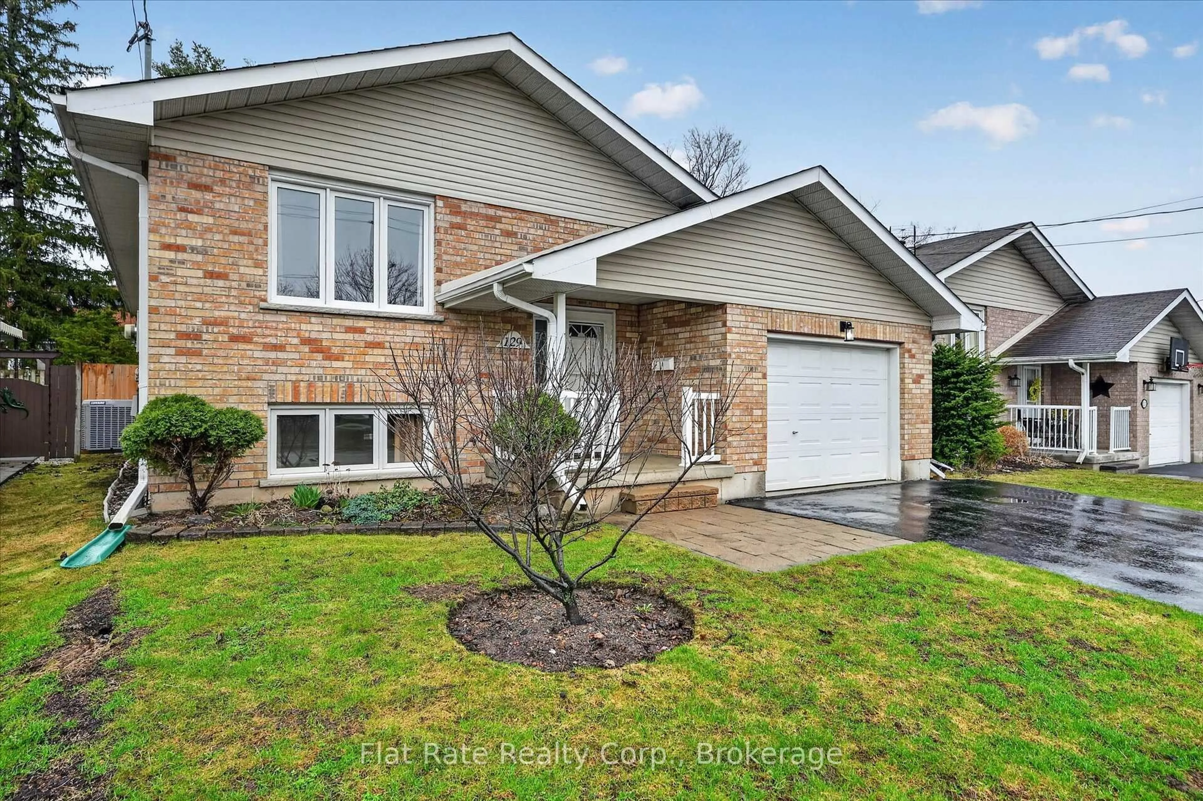 Home with brick exterior material, street for 129 Dumble Ave, Peterborough Ontario K9H 5A9