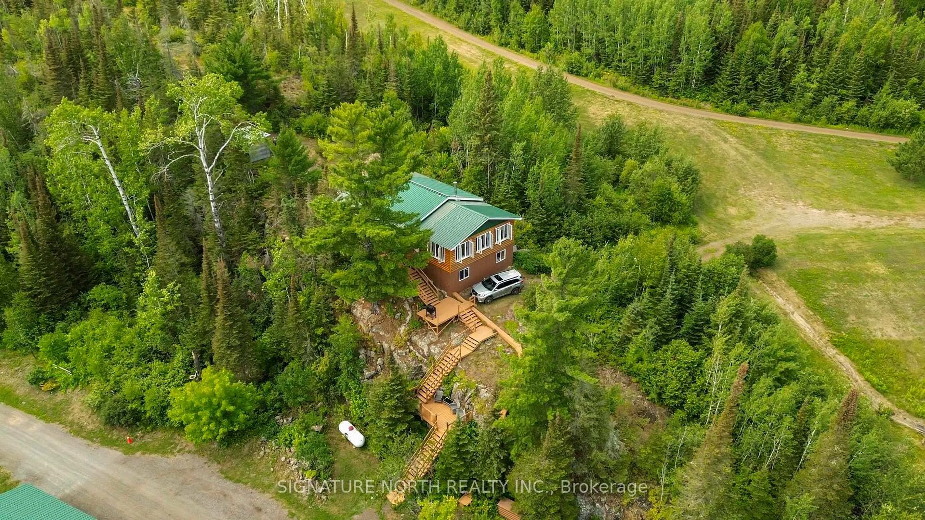 A pic from outside/outdoor area/front of a property/back of a property/a pic from drone, forest/trees view for 7081 HWY 61, Neebing Ontario P7L 0A1