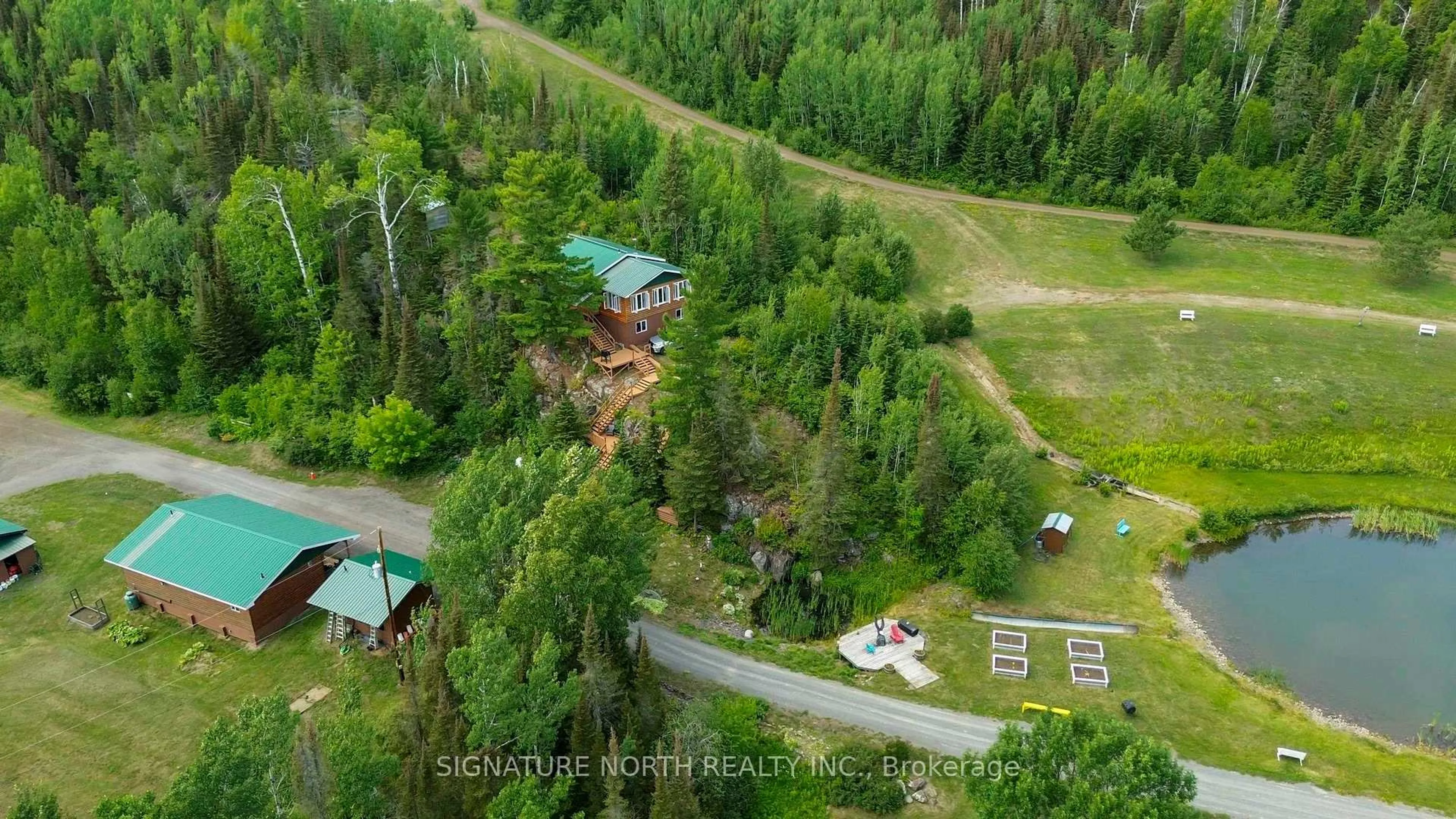 A pic from outside/outdoor area/front of a property/back of a property/a pic from drone, forest/trees view for 7081 HWY 61, Neebing Ontario P7L 0A1
