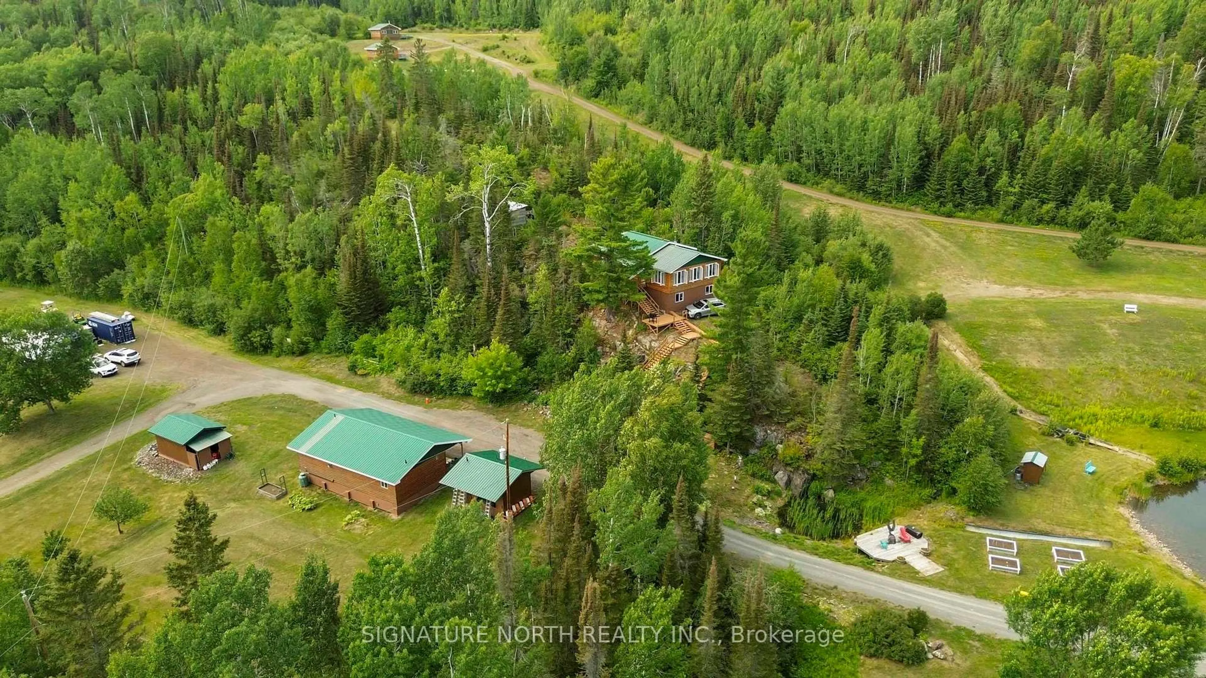A pic from outside/outdoor area/front of a property/back of a property/a pic from drone, forest/trees view for 7081 HWY 61, Neebing Ontario P7L 0A1