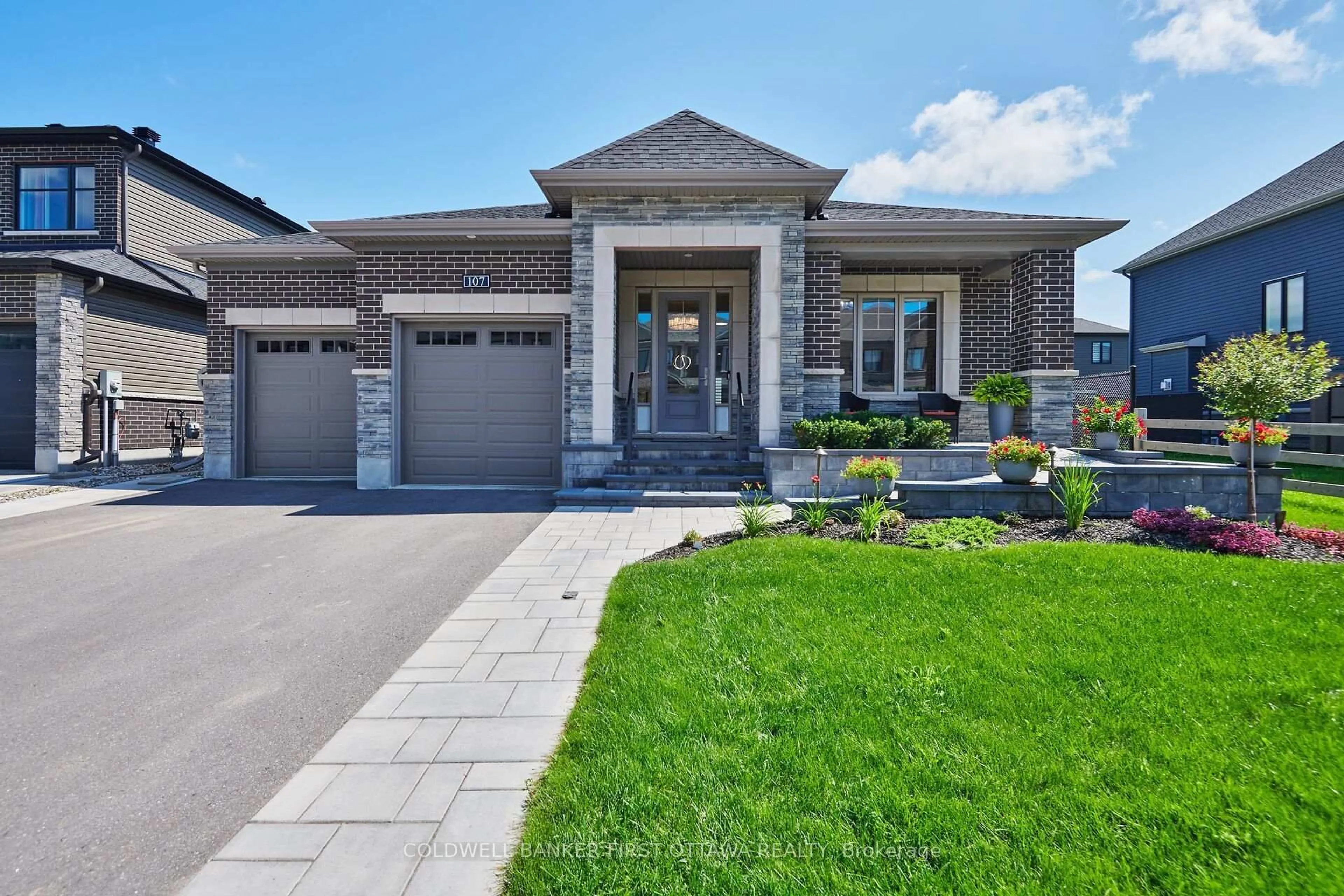 Home with brick exterior material, street for 107 Ascari Rd, Ottawa Ontario K4M 0M1