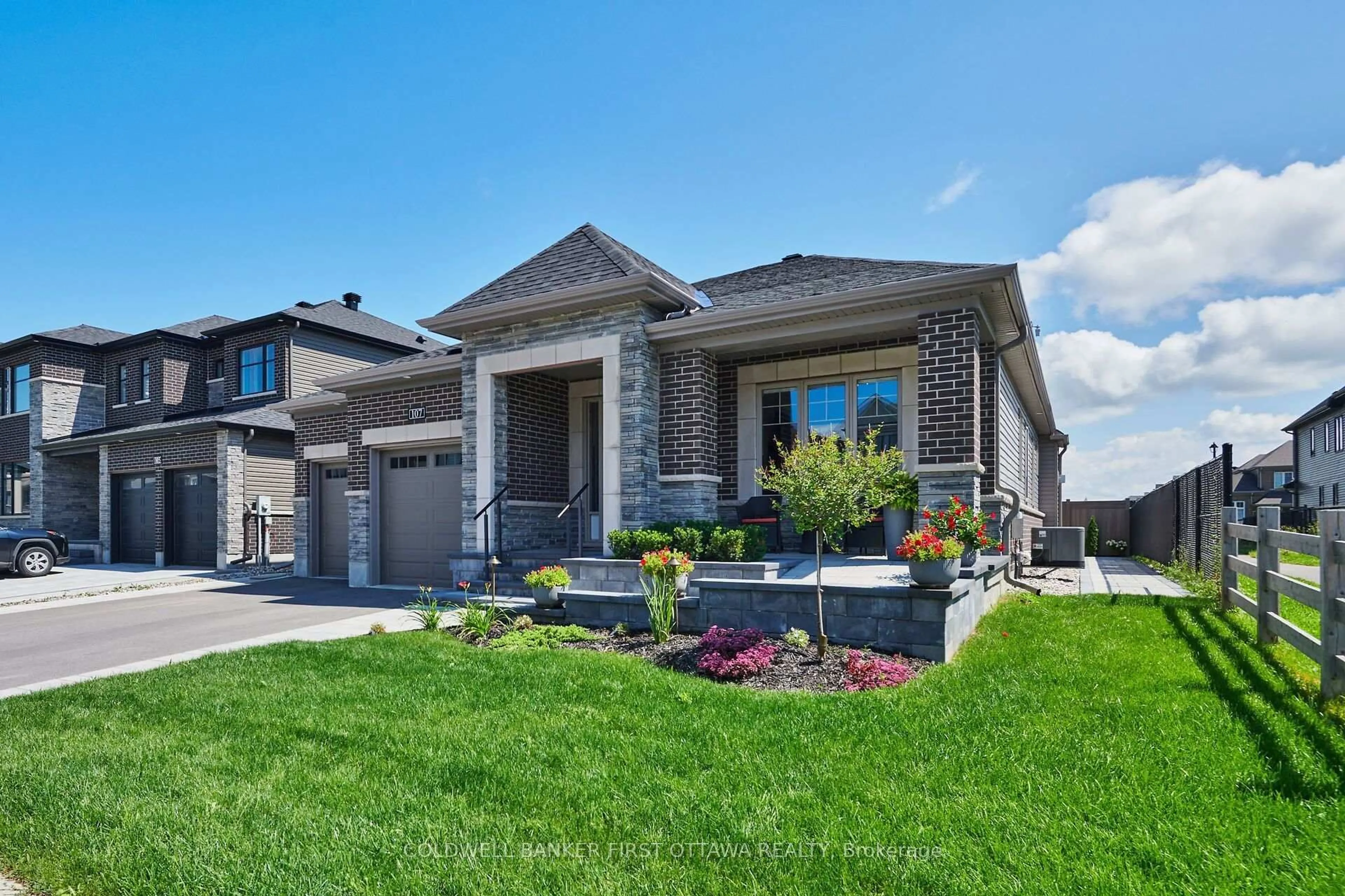 Home with brick exterior material, street for 107 Ascari Rd, Ottawa Ontario K4M 0M1