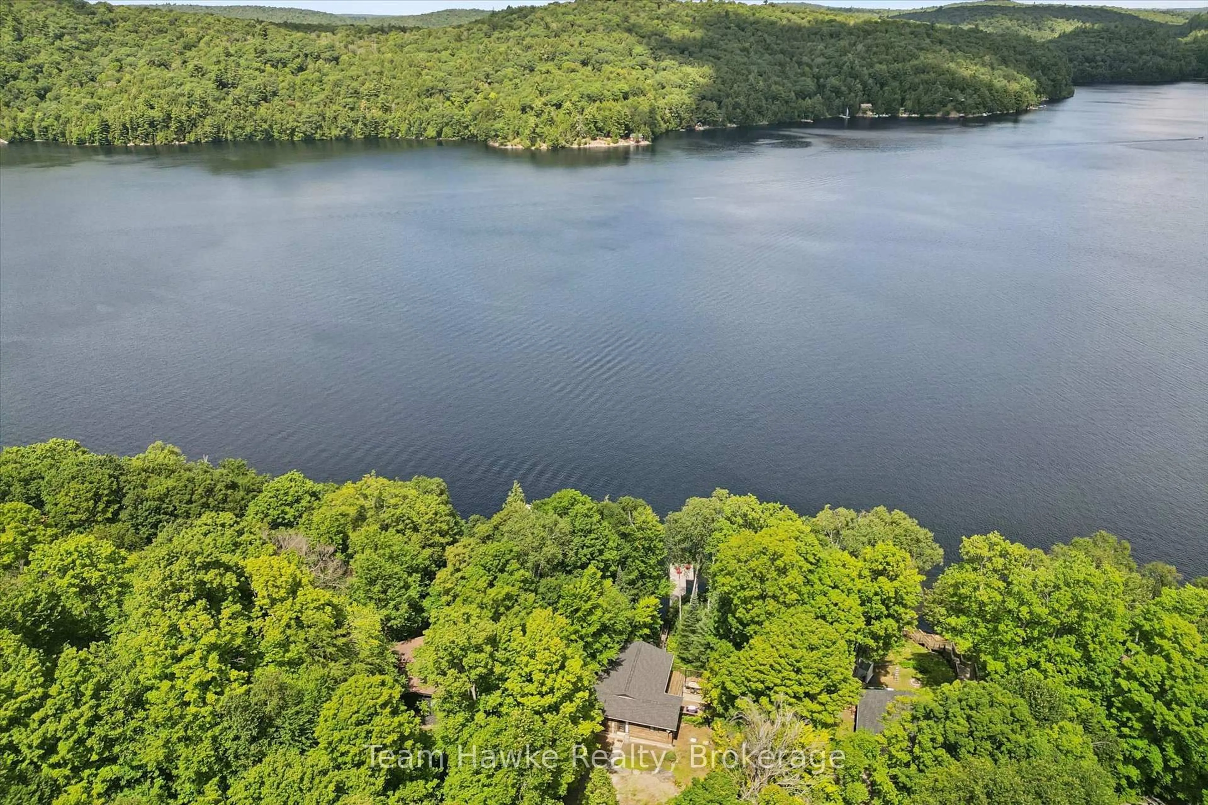 A pic from outside/outdoor area/front of a property/back of a property/a pic from drone, water/lake/river/ocean view for 3359 Maple Ridge Rd, Algonquin Highlands Ontario P0A 1E0