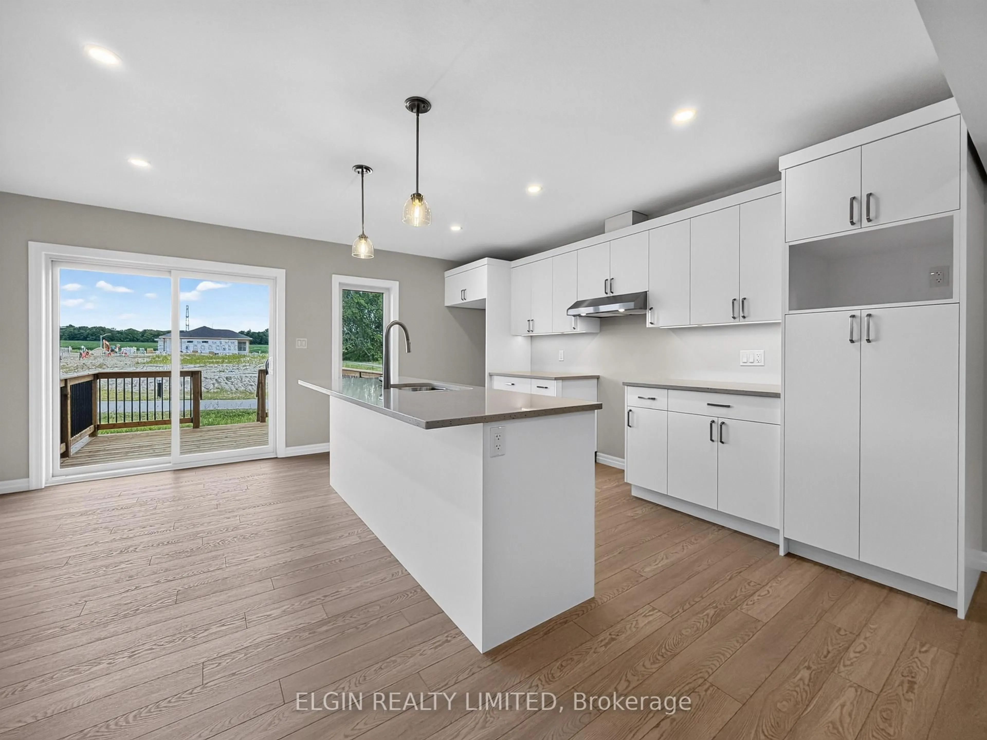 Open concept kitchen, wood/laminate floor for 38 Finch St, Tillsonburg Ontario N4G 0L9