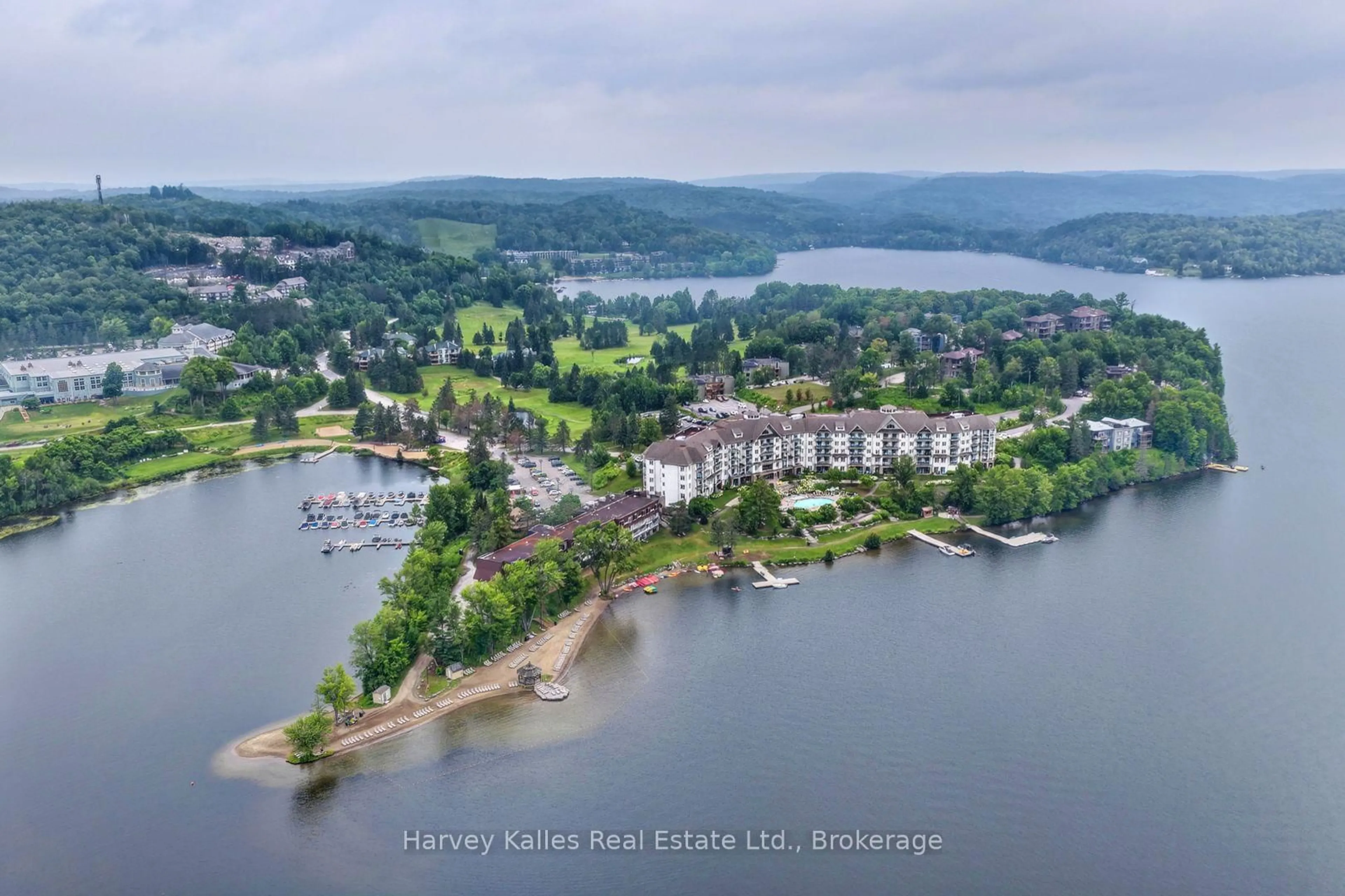 A pic from outside/outdoor area/front of a property/back of a property/a pic from drone, water/lake/river/ocean view for 26 Deerhurst Golfview Dr #303, Huntsville Ontario P1H 1A9